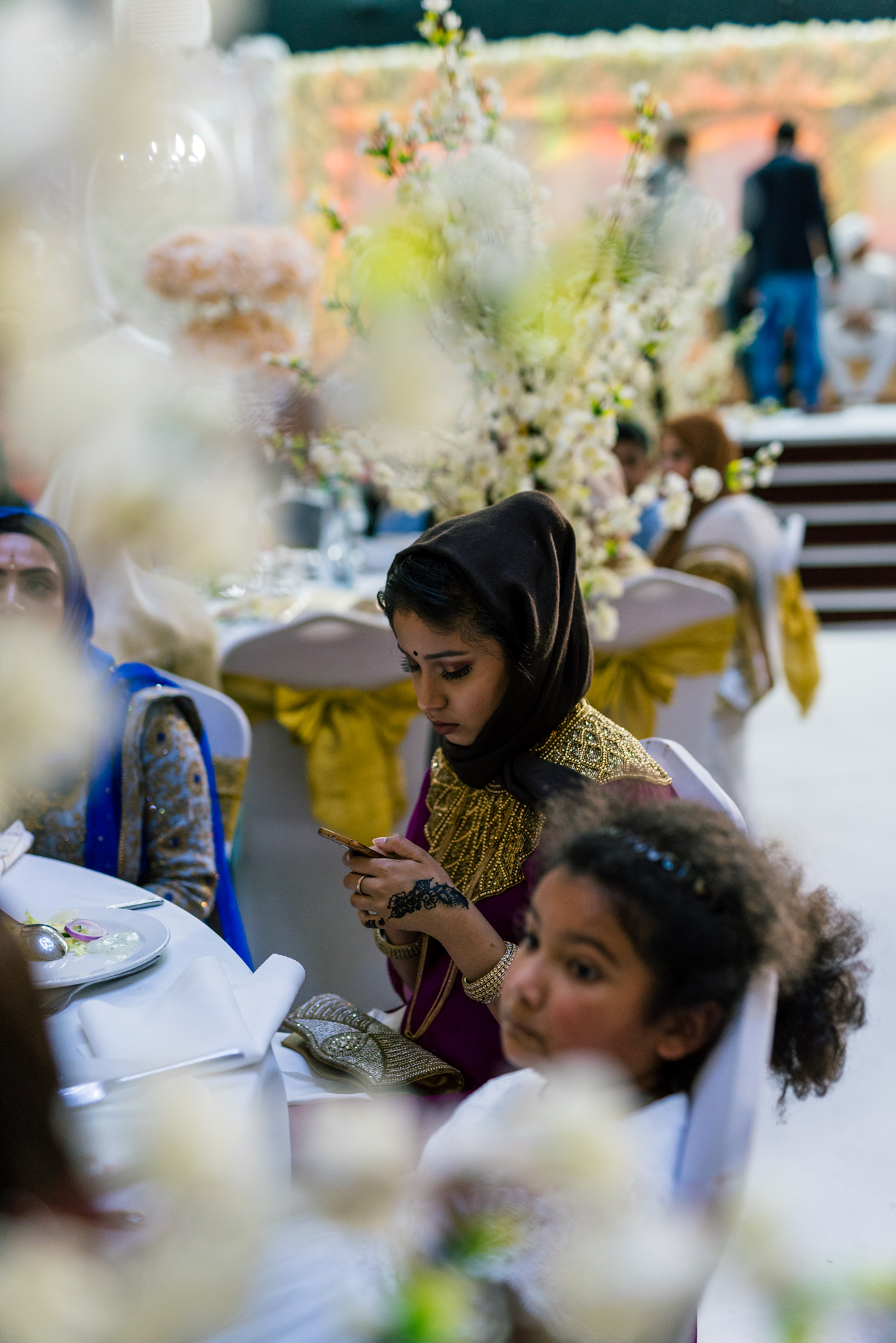 wedding guests wait patiently for the start of the ceremony