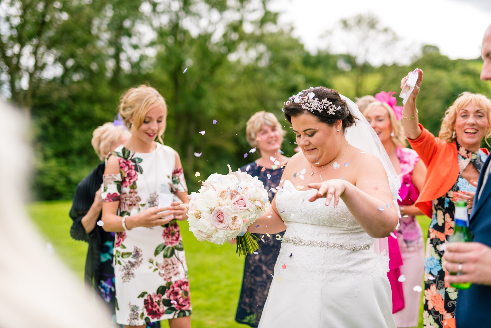 bride tries to get rid of some confetti