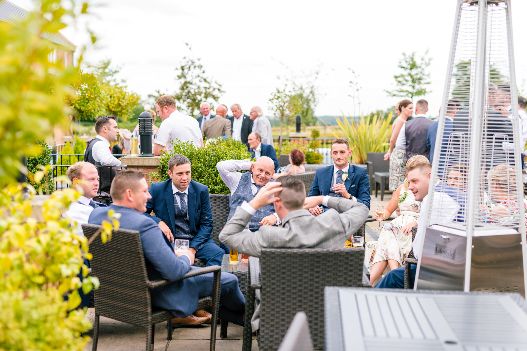 guests having a laugh in the sunshine