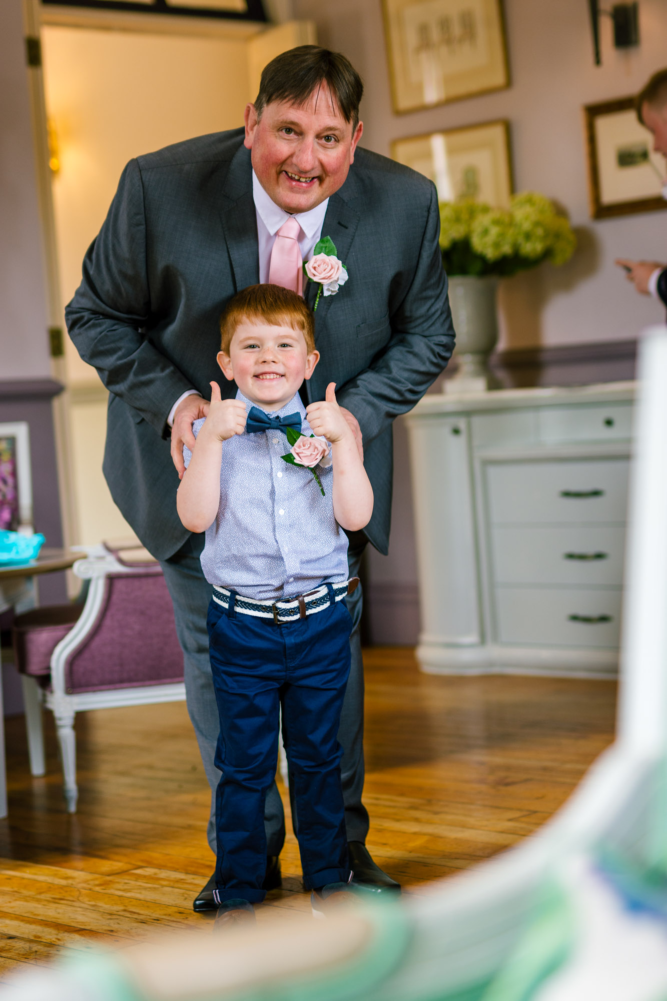 little boy giving a thumbs up to the camera 