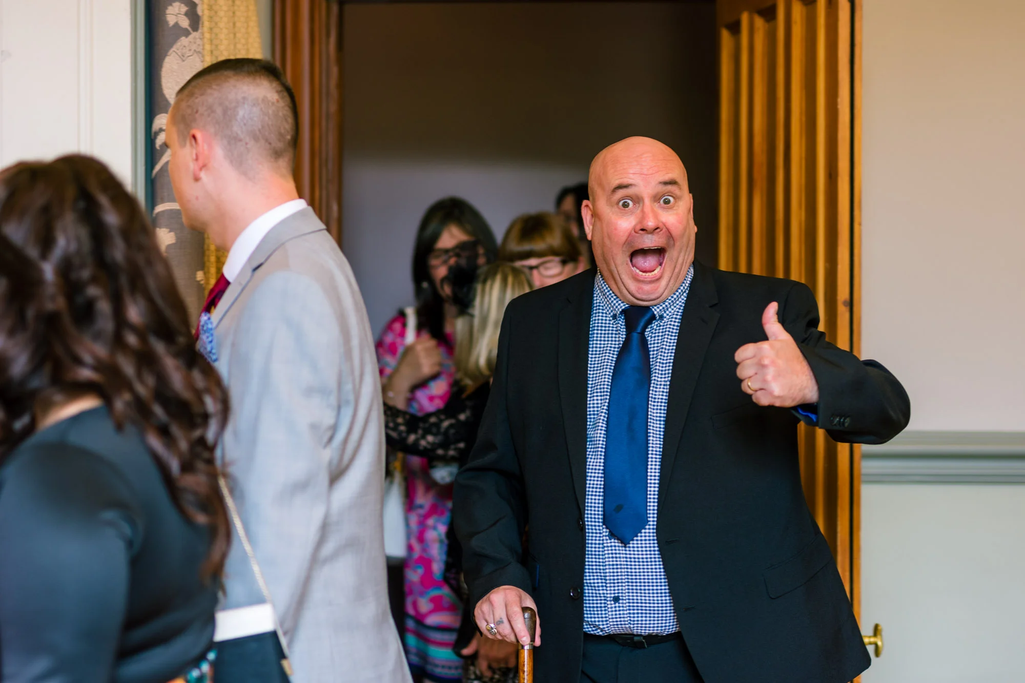 Very happy wedding guest gives a thumbs up