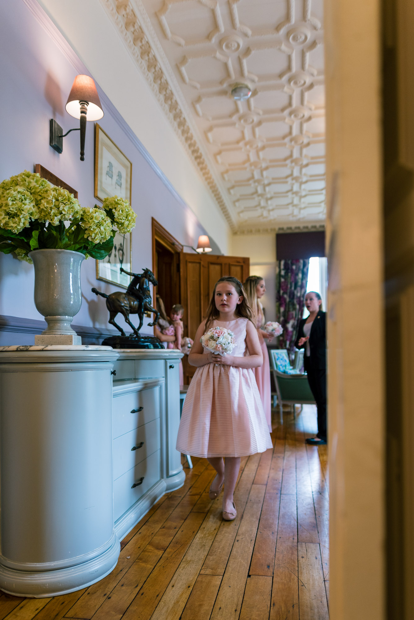 Flower girl walks into the wedding ceremony