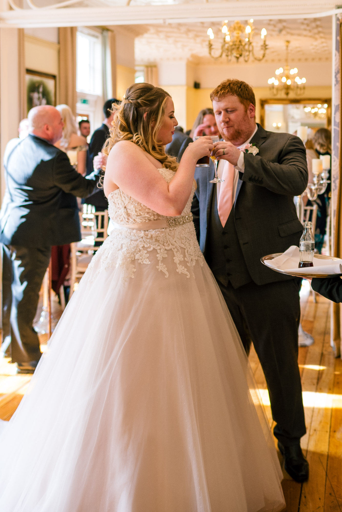 Bride and groom enjoy a drink together