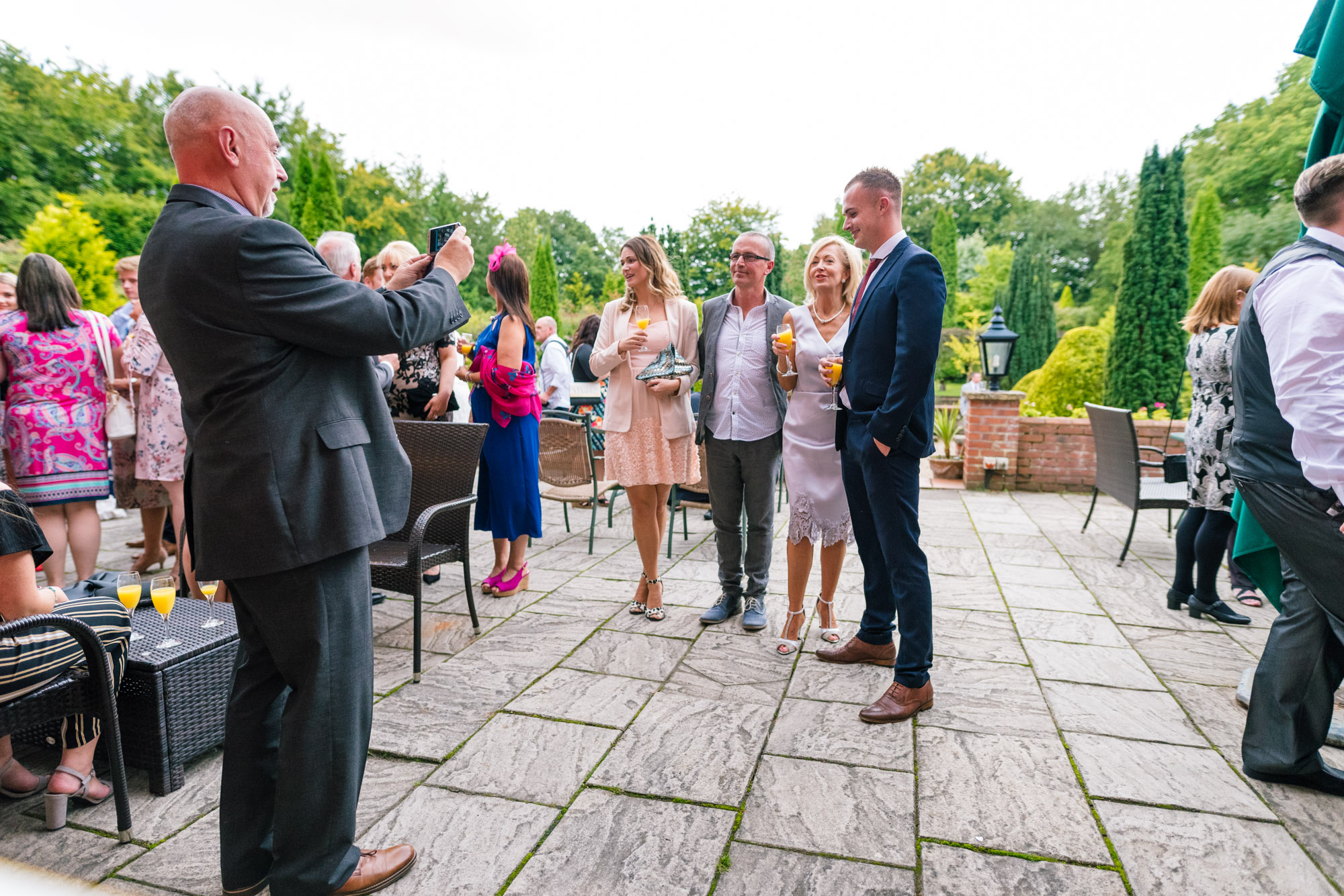 Guests take selfies outside nunsmere hall