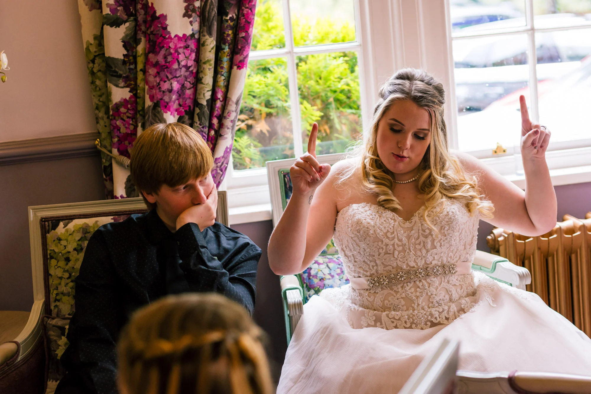 Bride having fun with her brother