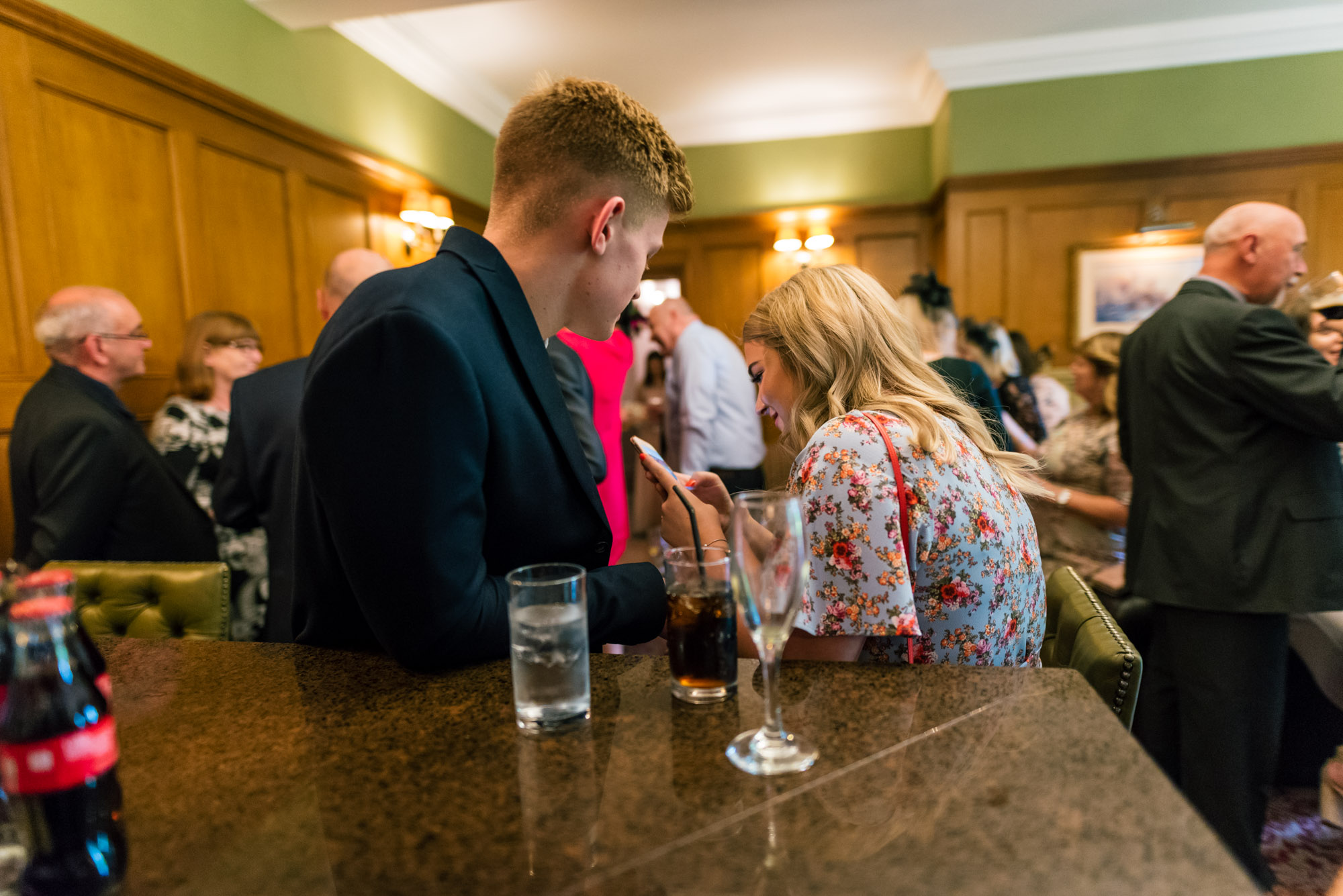 Wedding guests having a drink or two