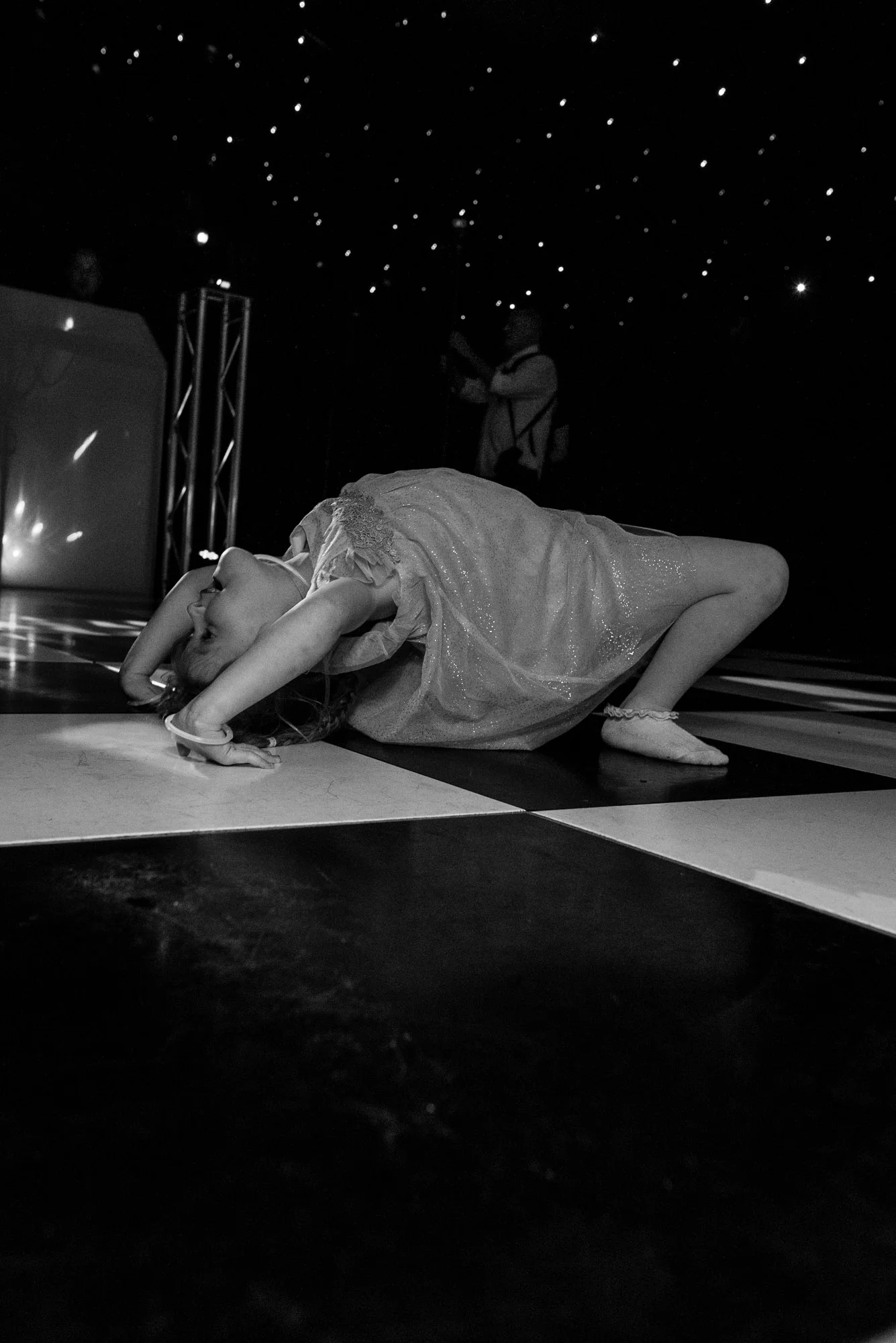 a child playing on the dance floor