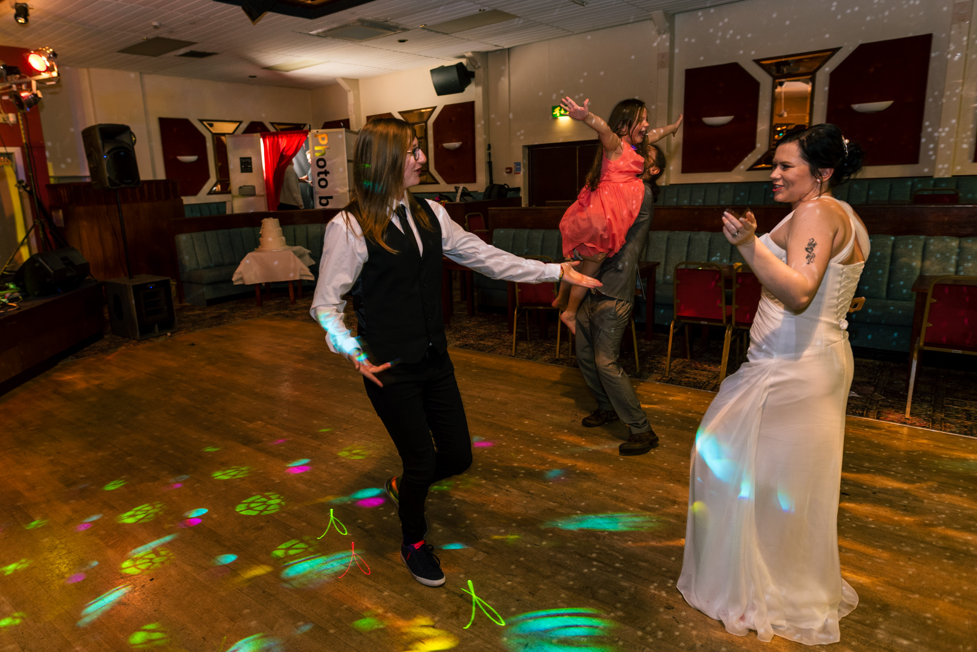 Bride and friends dancing on the dance floor.