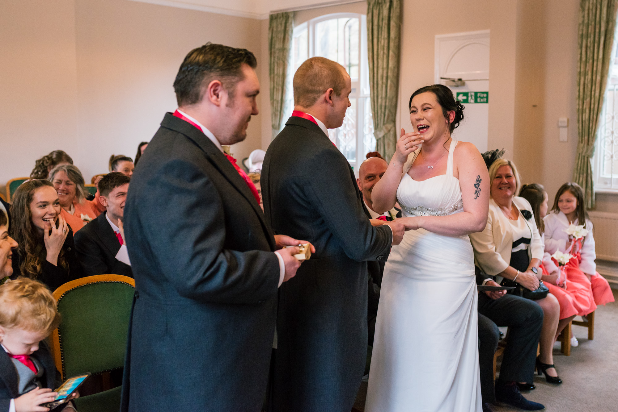 Bride laughs at a mistake the Groom makes during his vows.