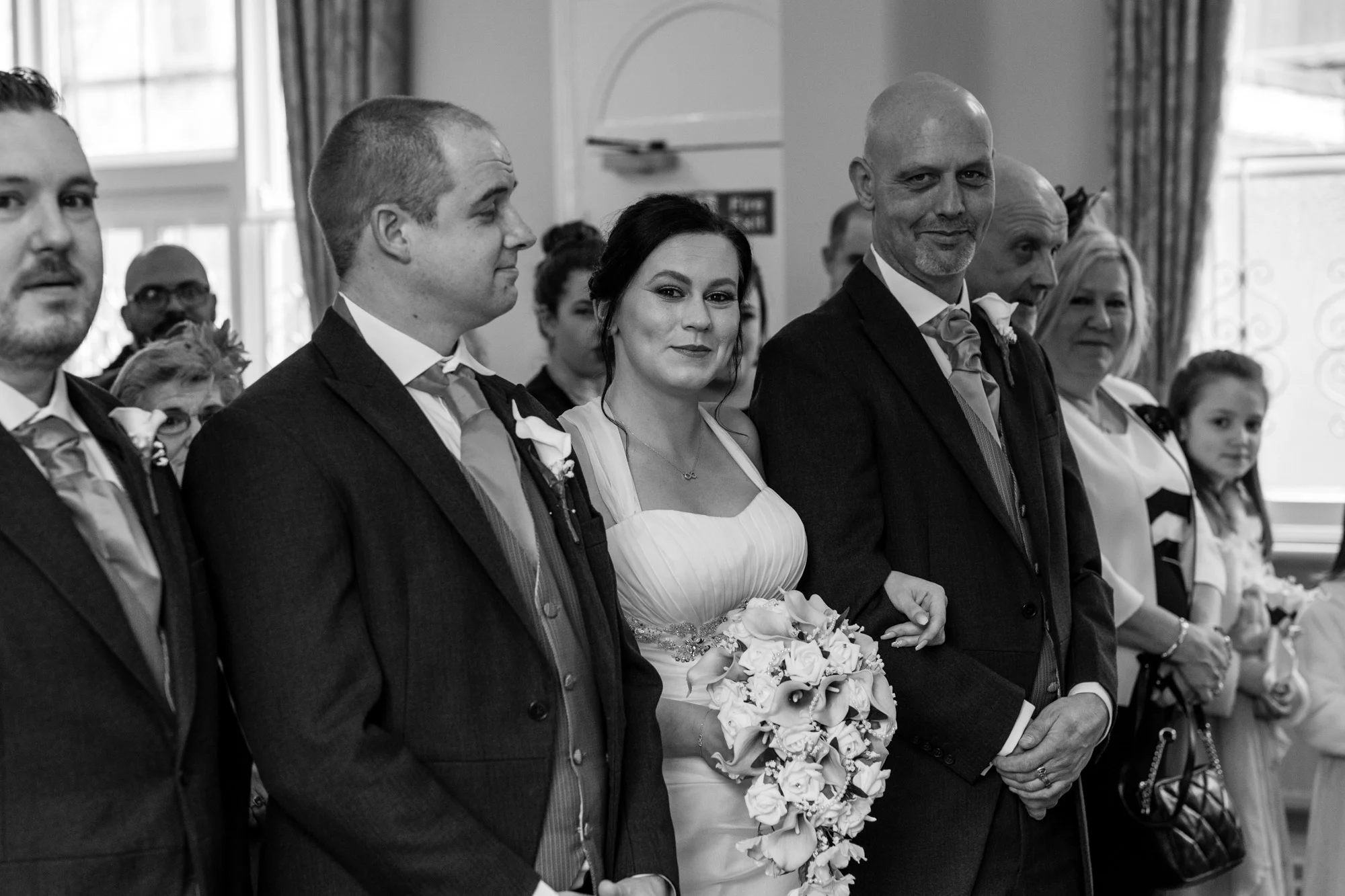 Sophi being given away by her Dad to he husband to be.
