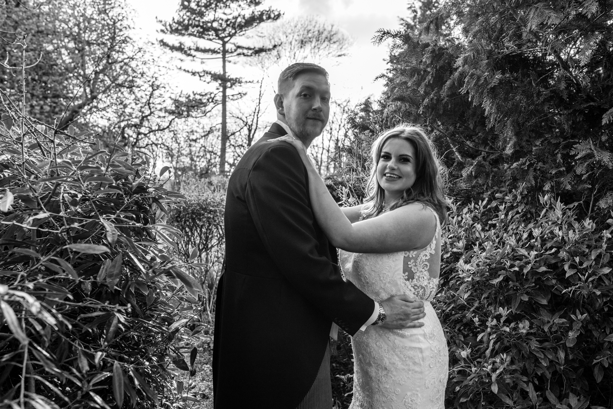 Black and white image of a back lit bride and groom in Cheshire.
