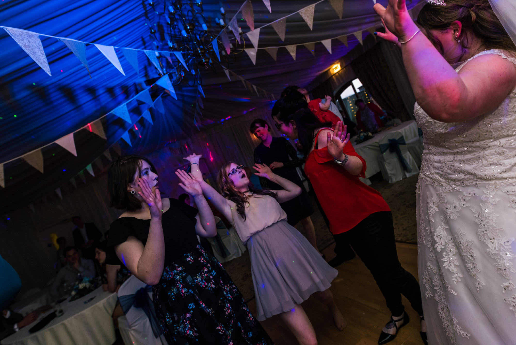 Guests dancing with the bride