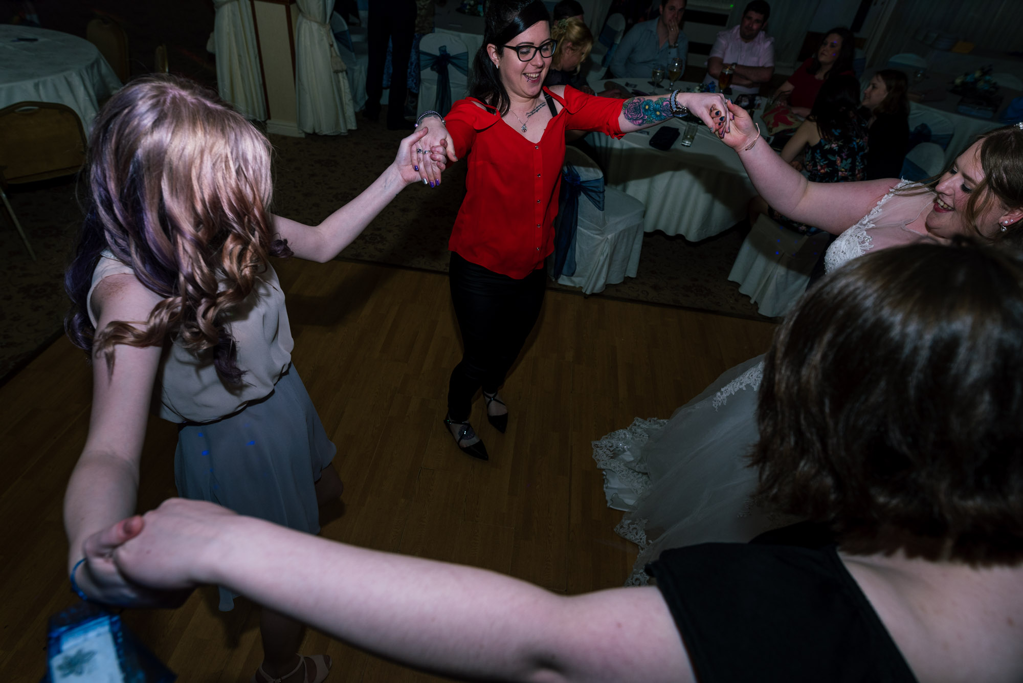Guests dance with the bride