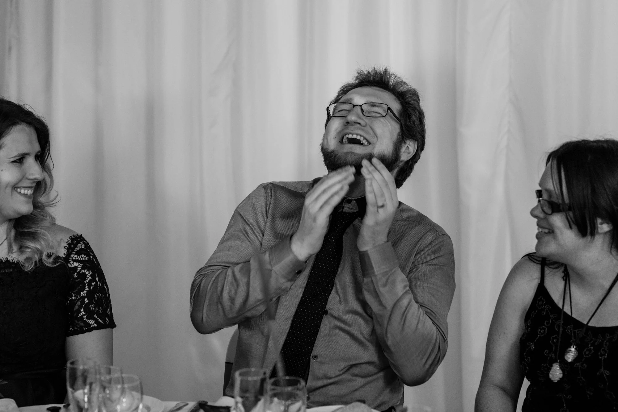 A guest enjoys a belly laugh