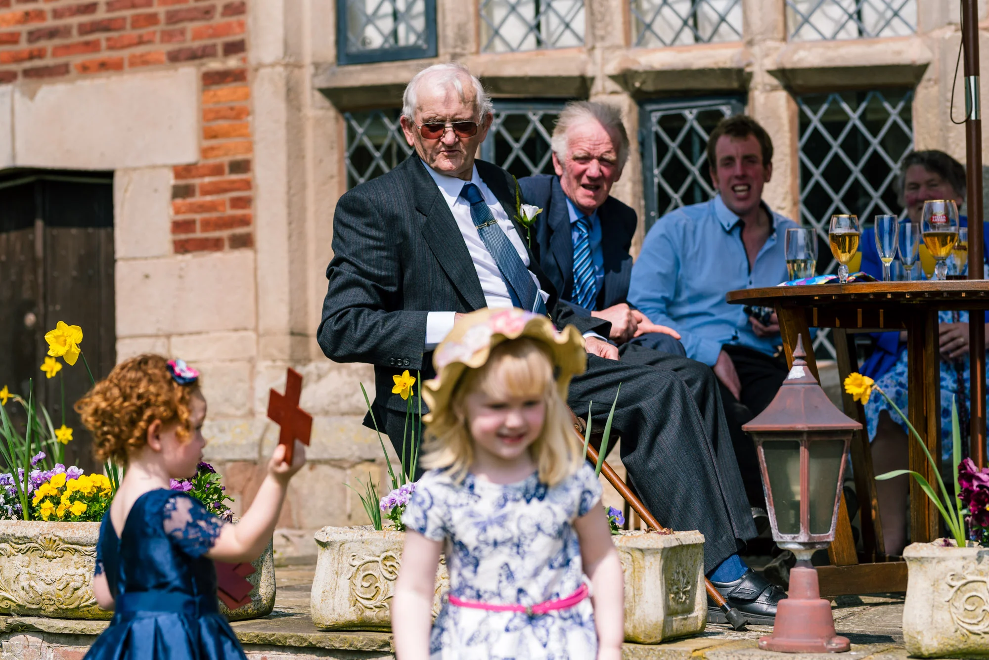 Wedding guests enjoy the sunshine