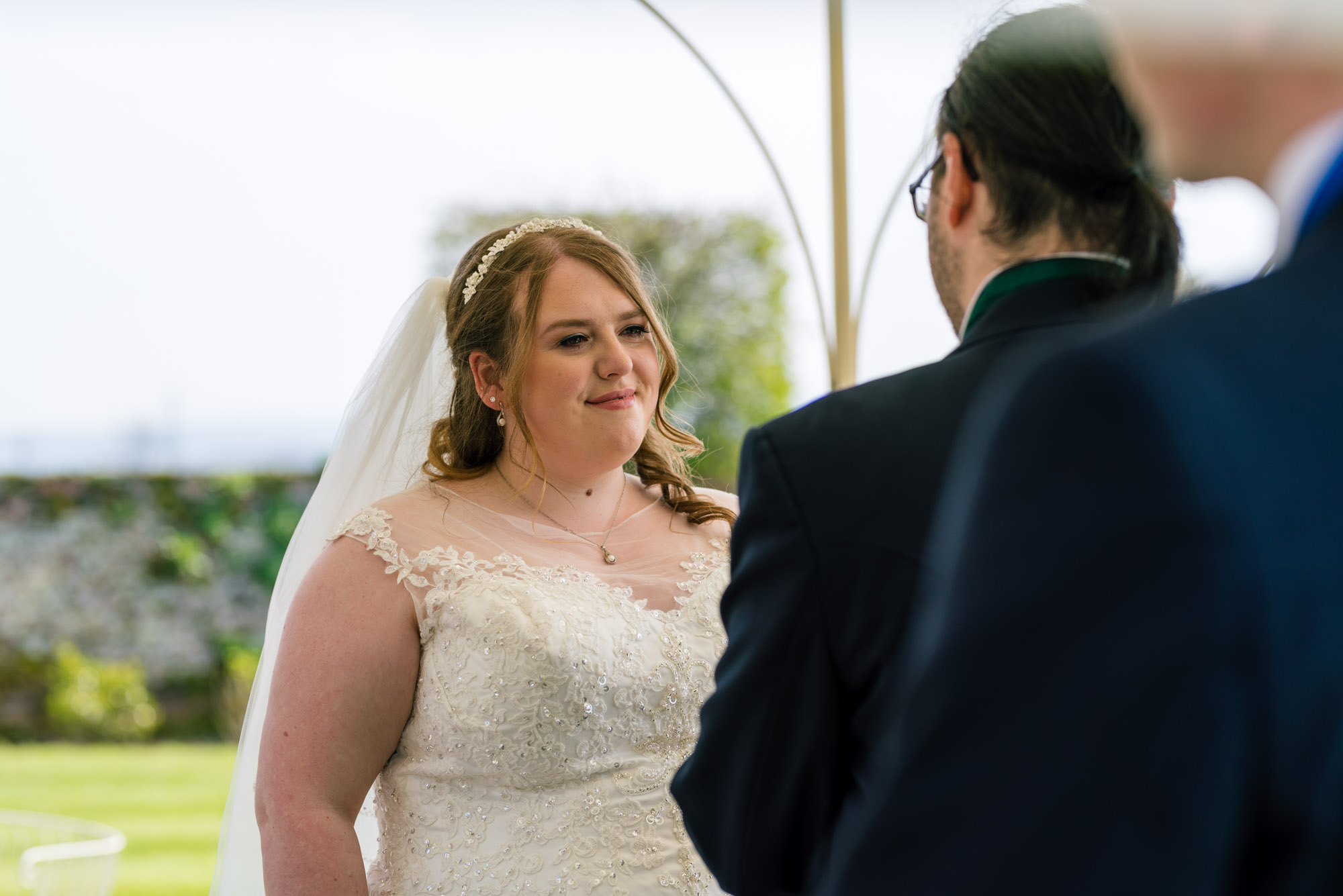 Bride looks into the eyes of her groom during the vows