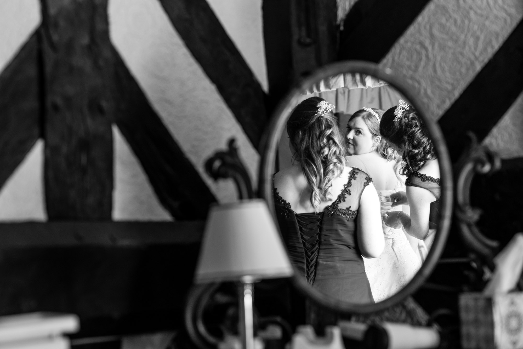 Lacing the brides dress up.