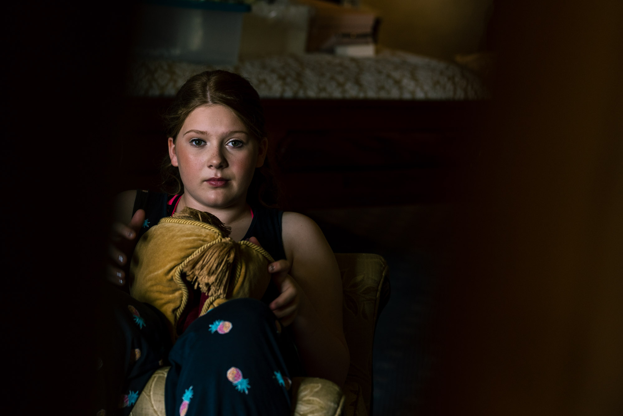Bridesmaid relaxes during the bridal prep