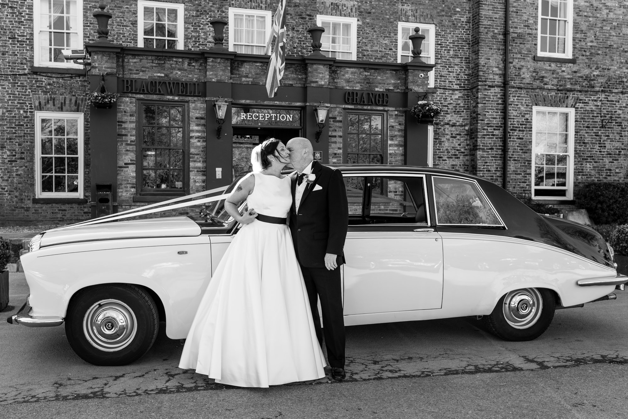 A kiss in front of the car