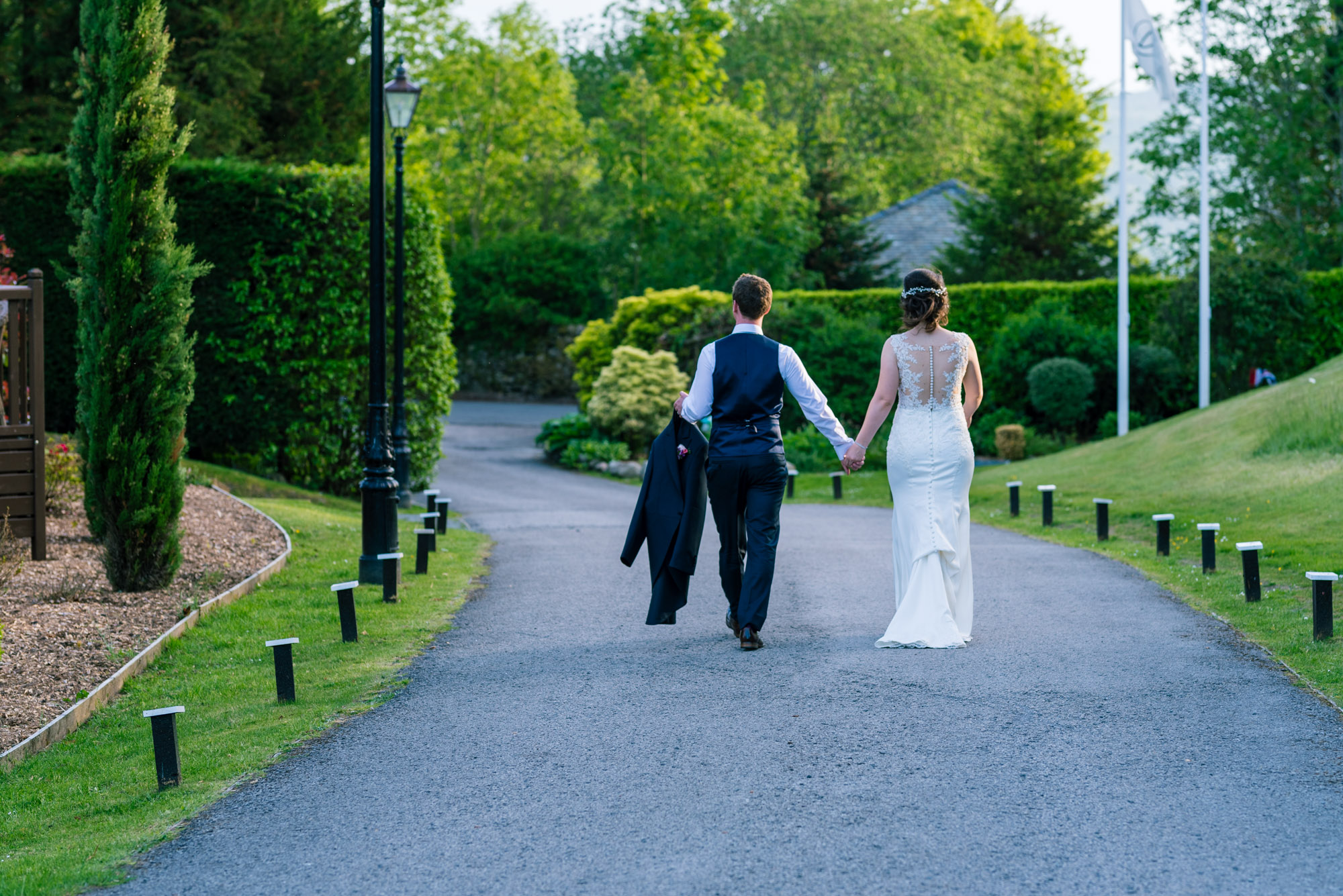 Bride and groom walking away
