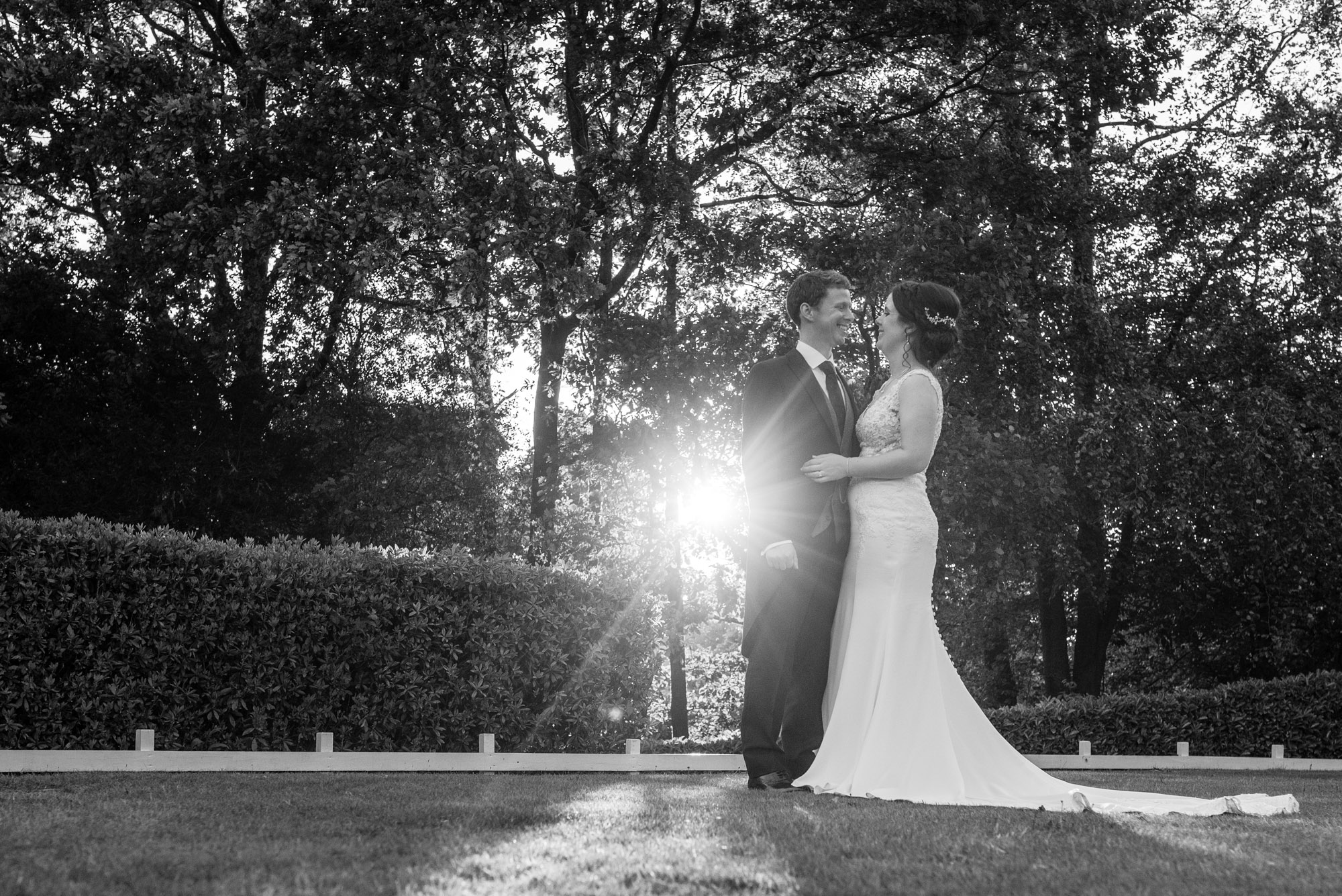 The happy couple backlit by the sun 