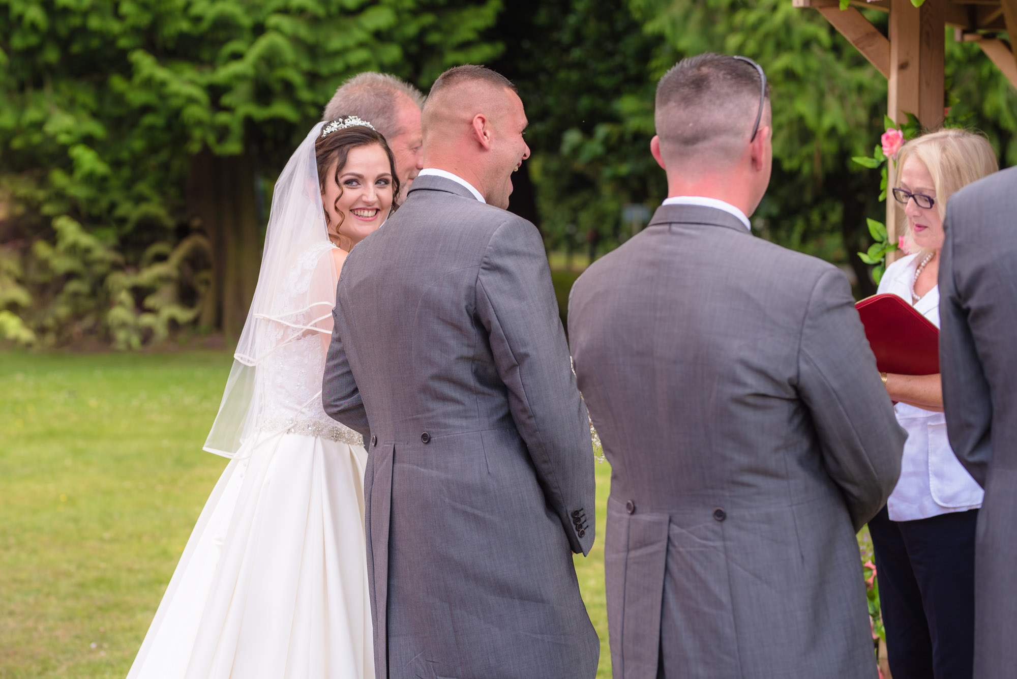 Bride smiles at her guests