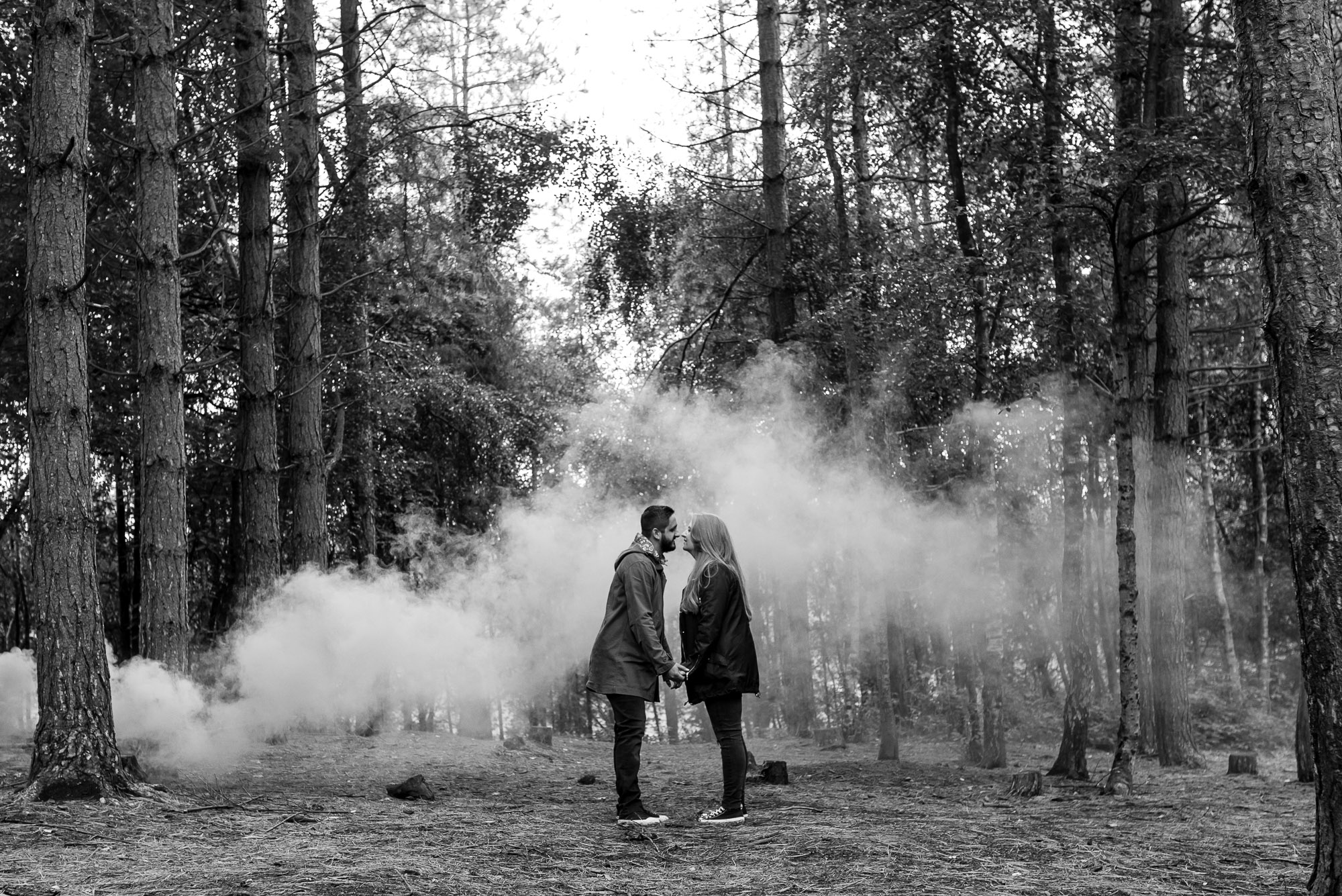 Kissing in front of a smoke grenade 