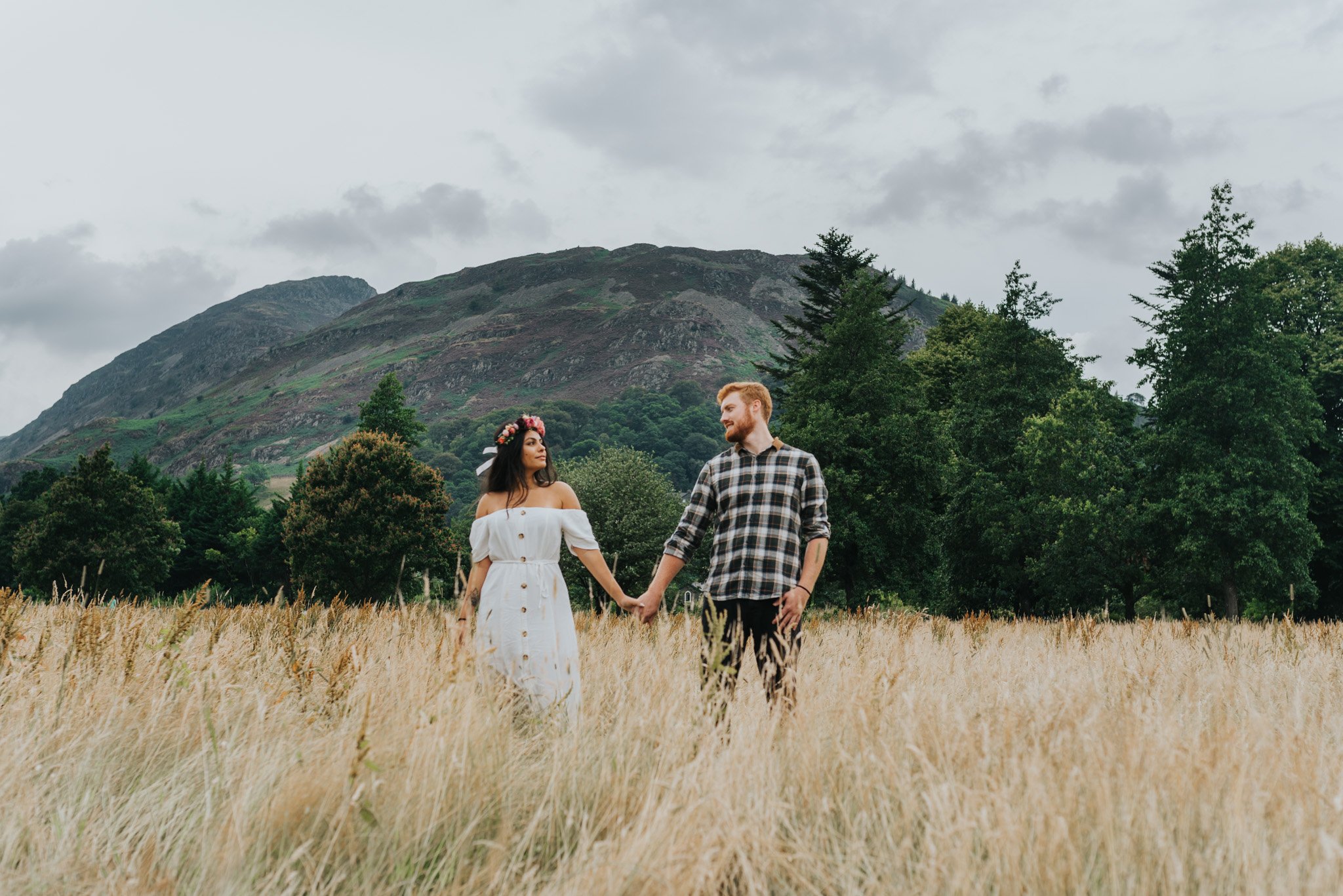 Holding hands in the grass