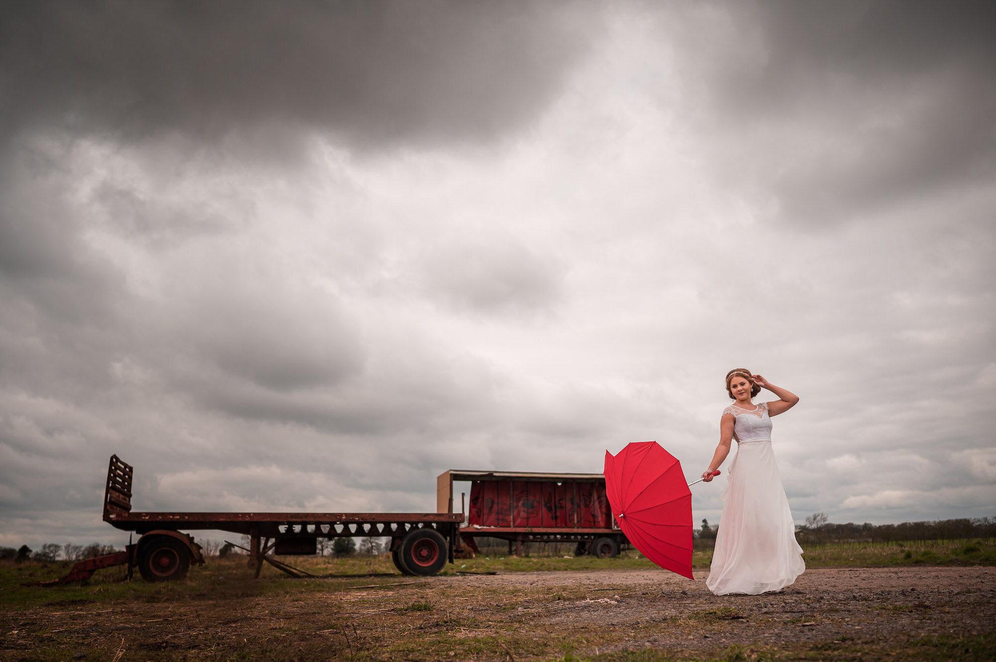 Bride with red umbrella