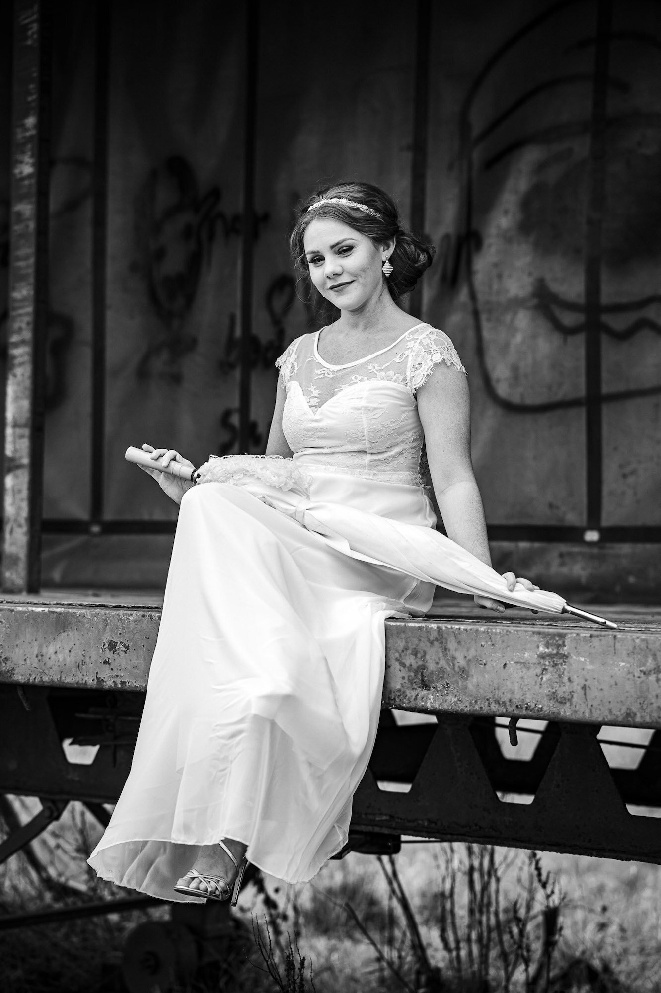 Bride sitting on a trailer B&amp;W