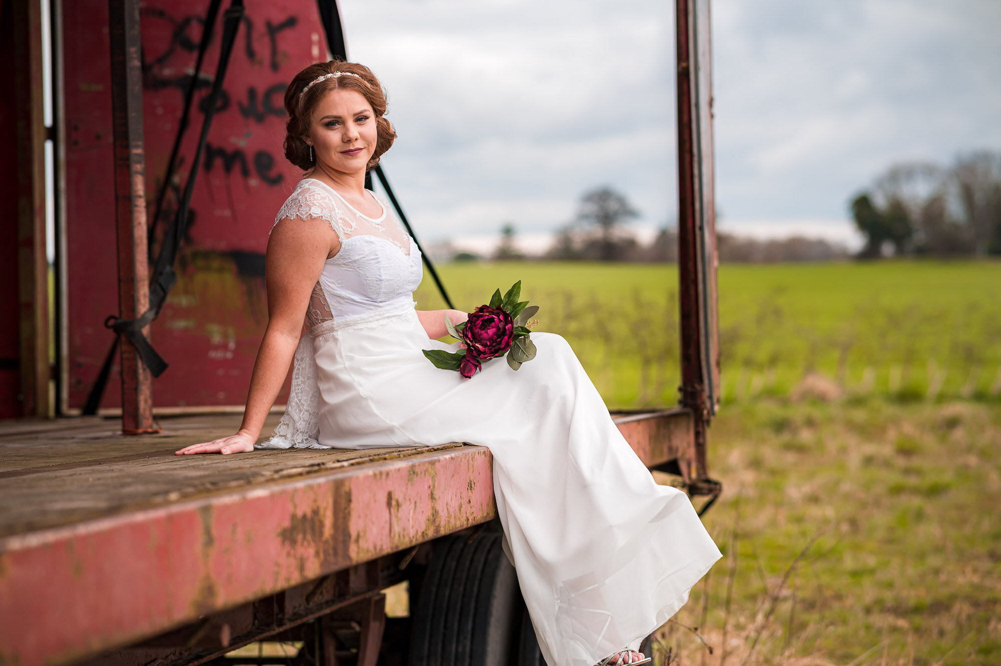 Bride sitting with flowers