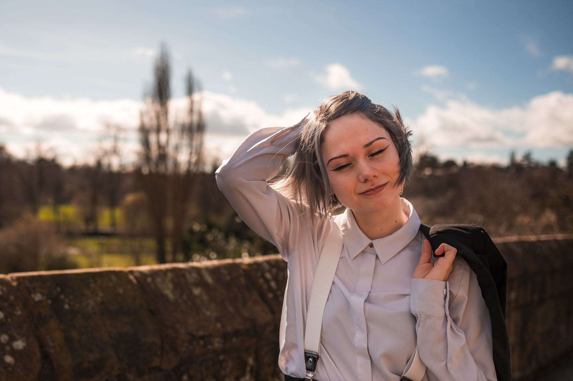 Model brushing her hair wearing braces