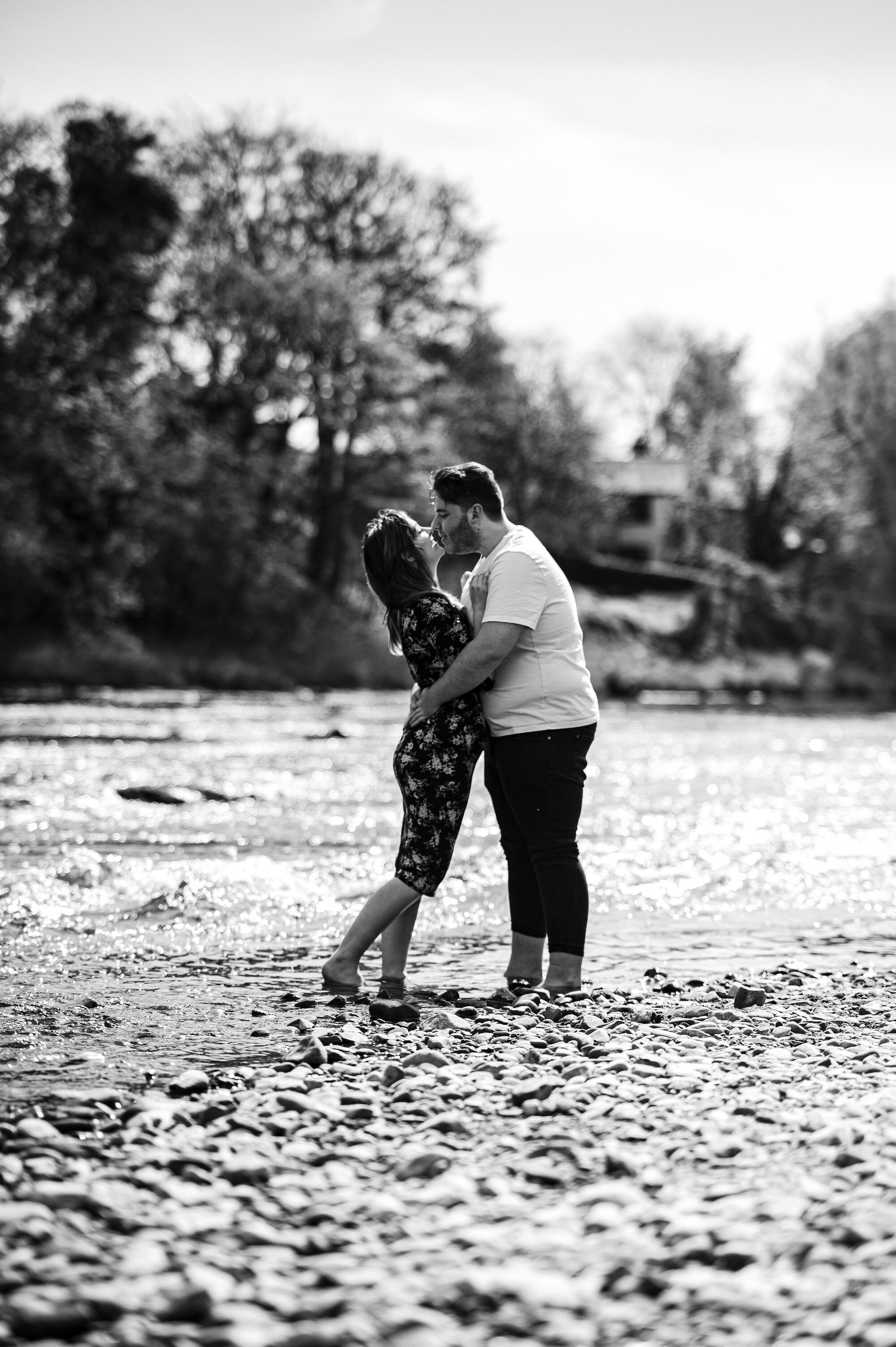 Couple cuddling in the river