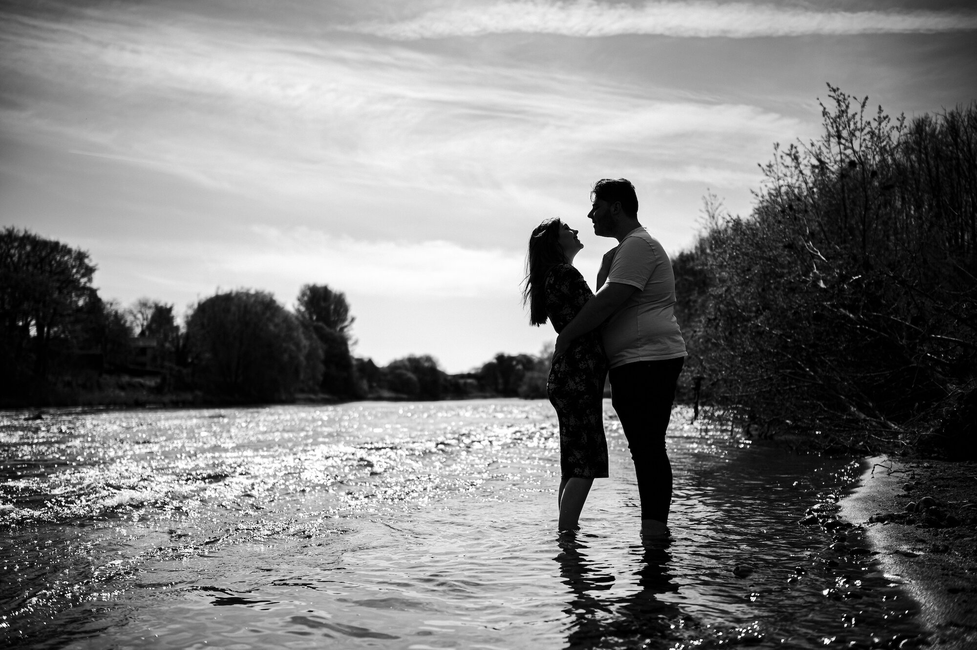 Silhouette of couple in the river