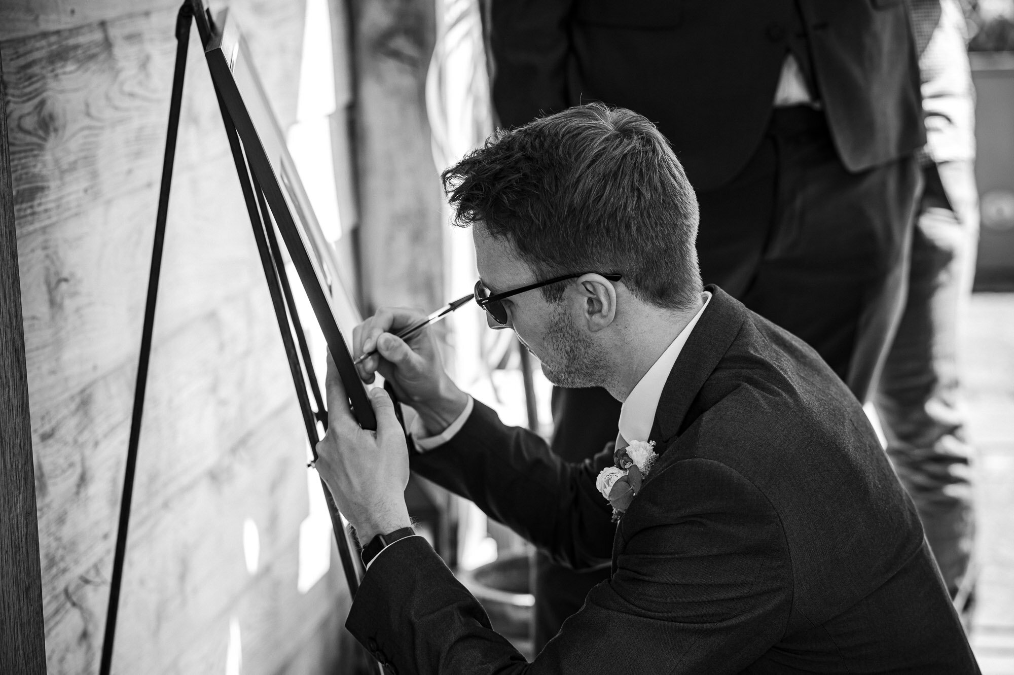 Guest writing on the signing board