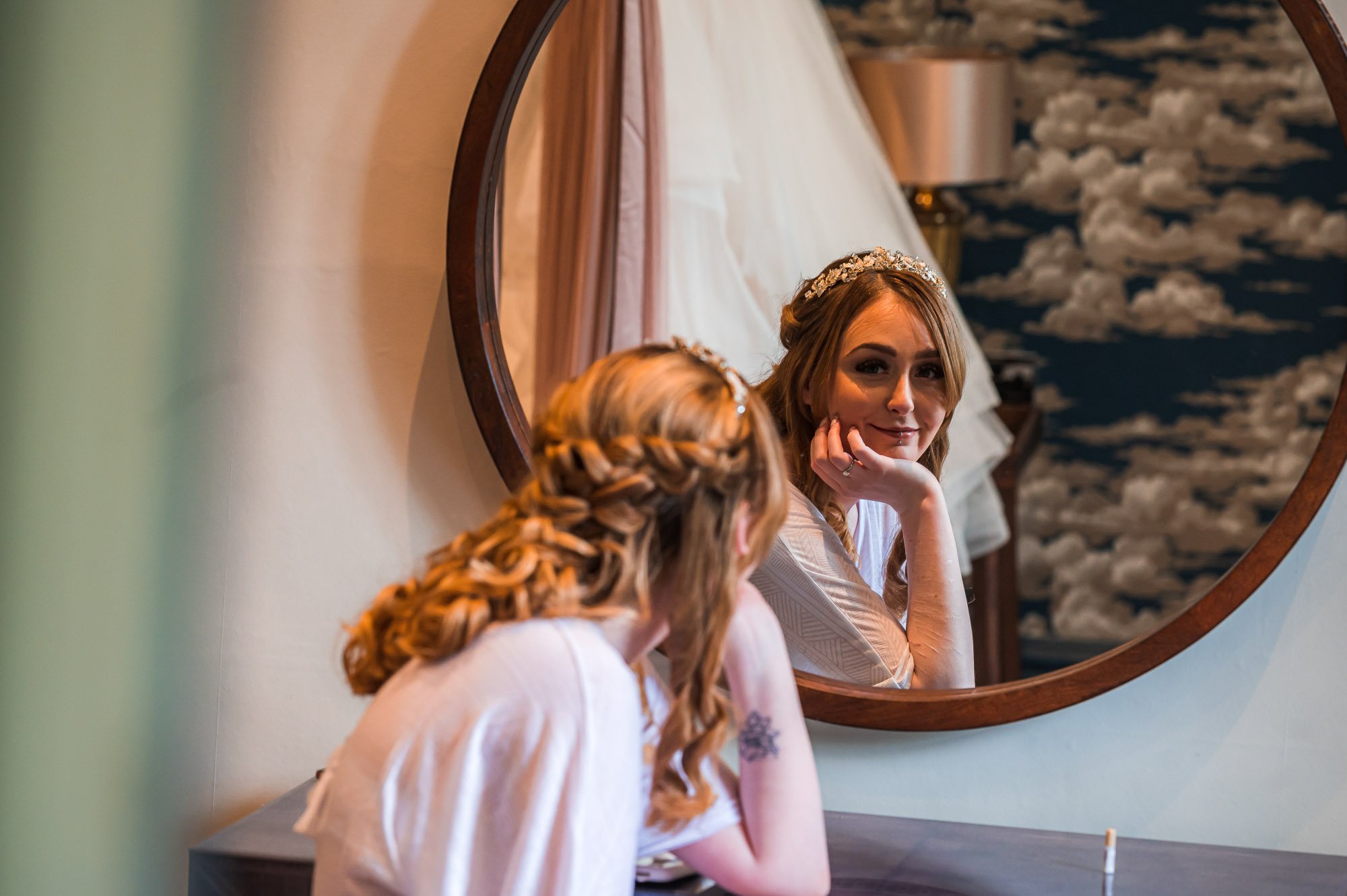 Bride looks in the mirror