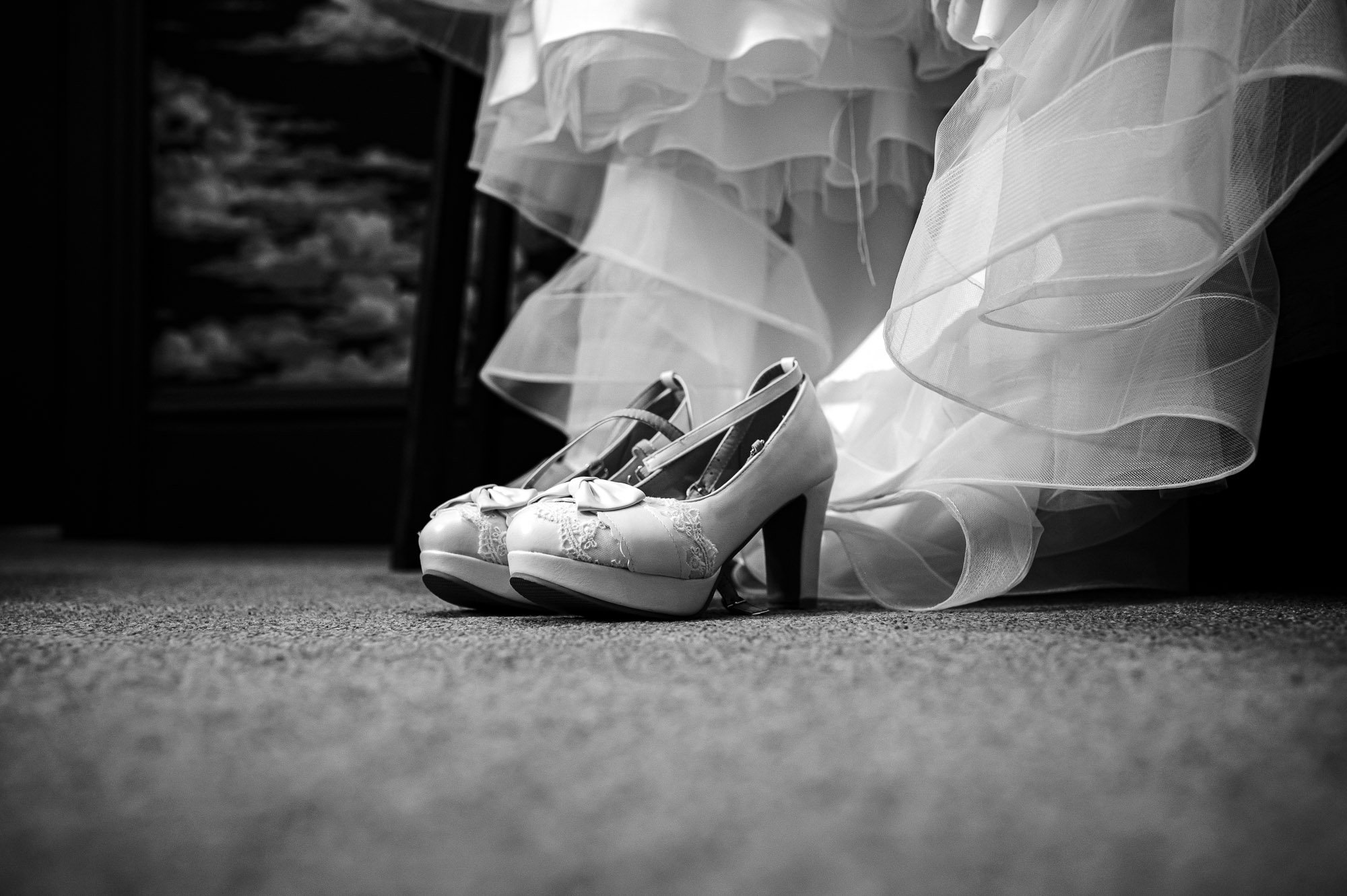 Bridal shoes and wedding dress detail