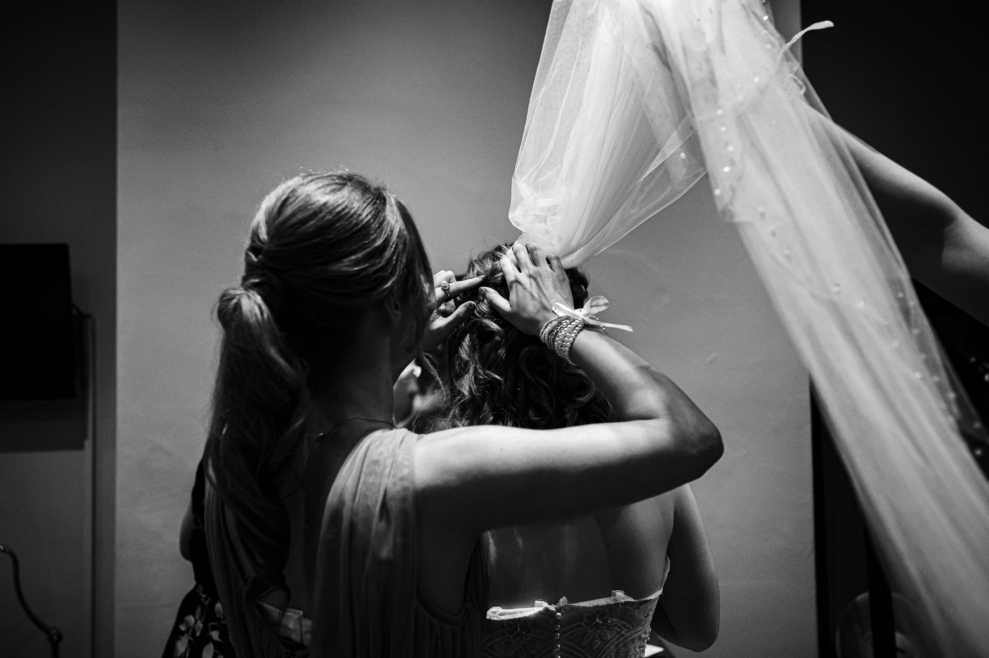 Bride getting her veil put on.