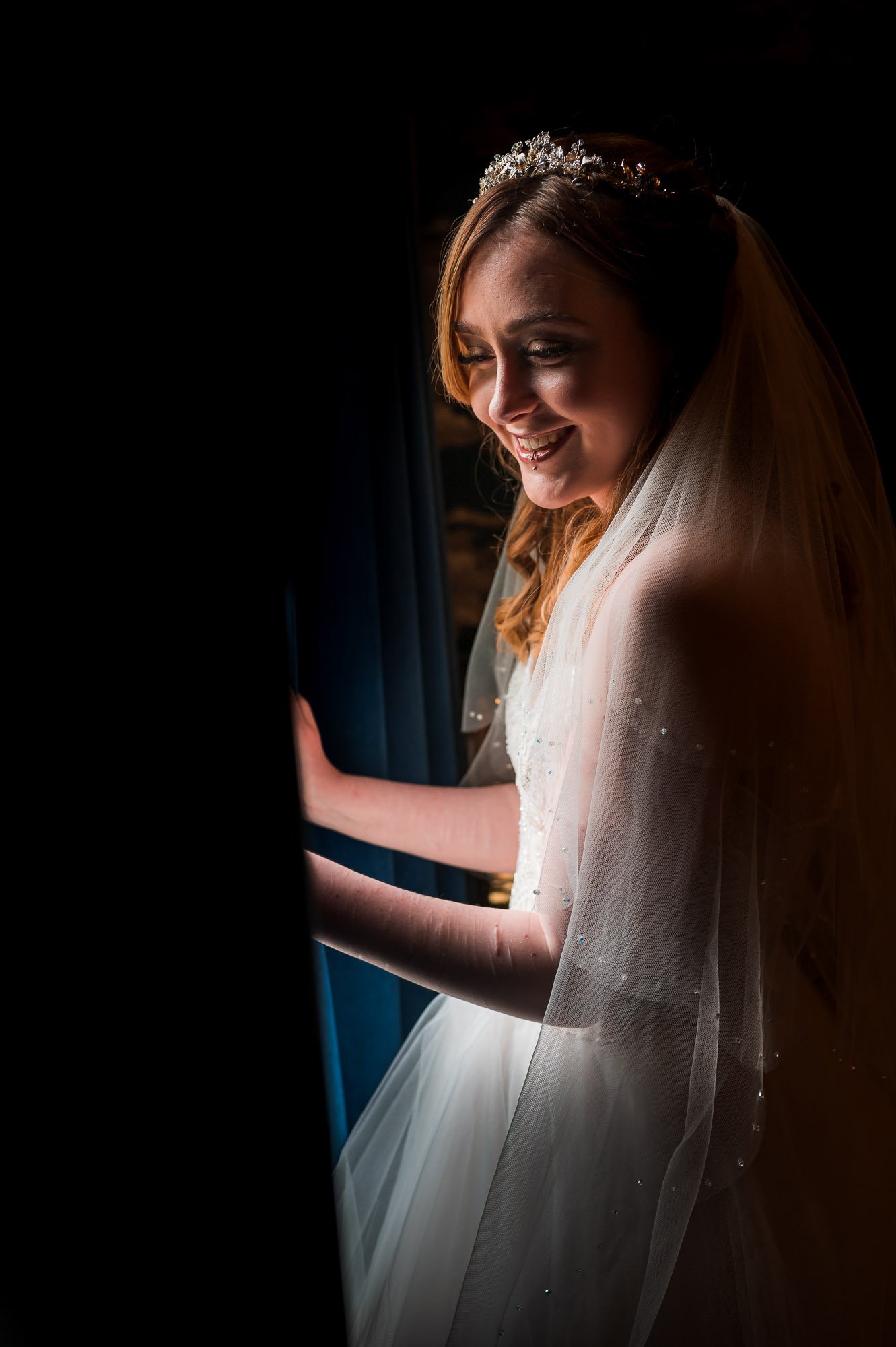 Bride at the window looking down