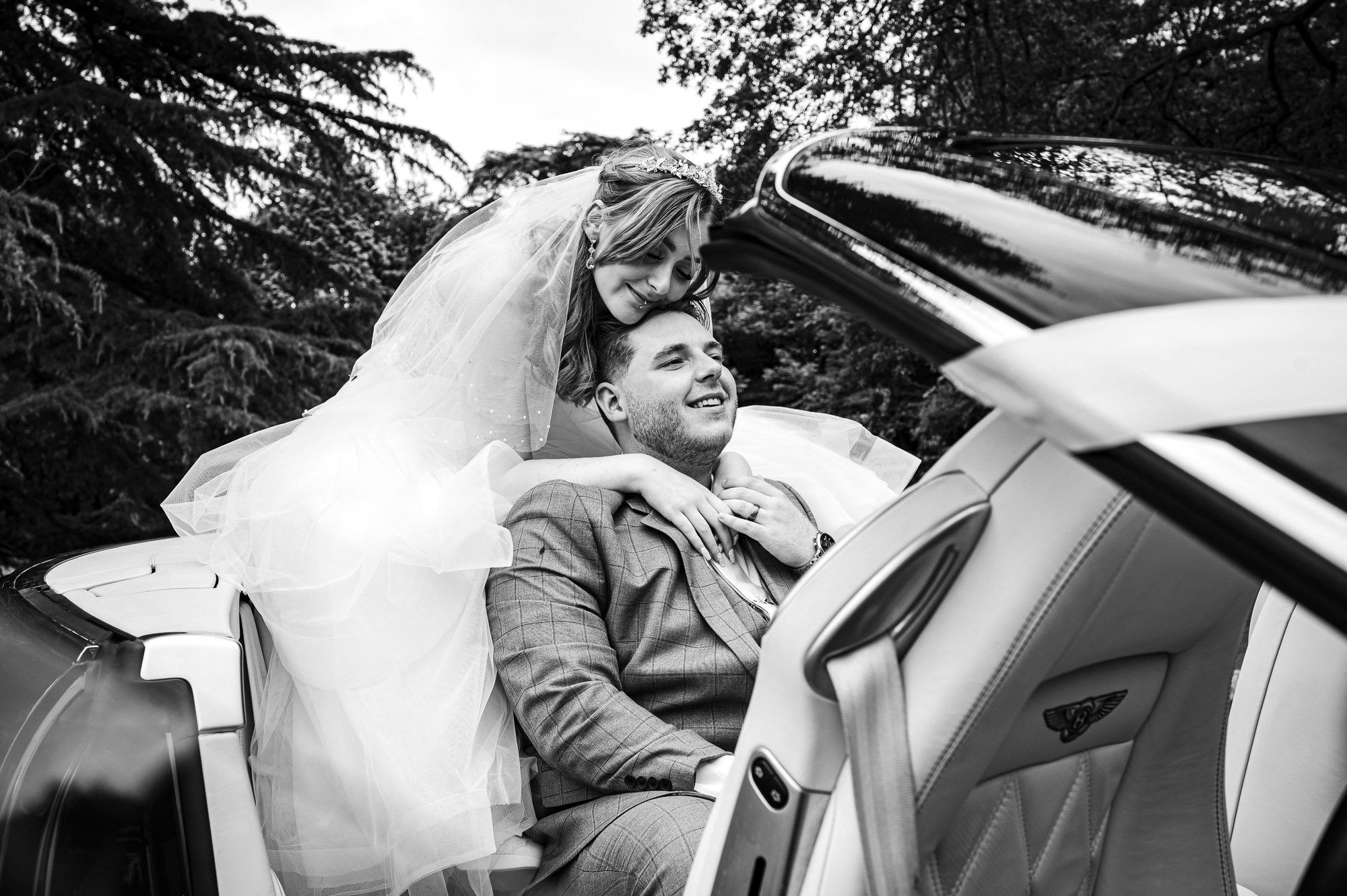 Bride and Groom in their bridal car