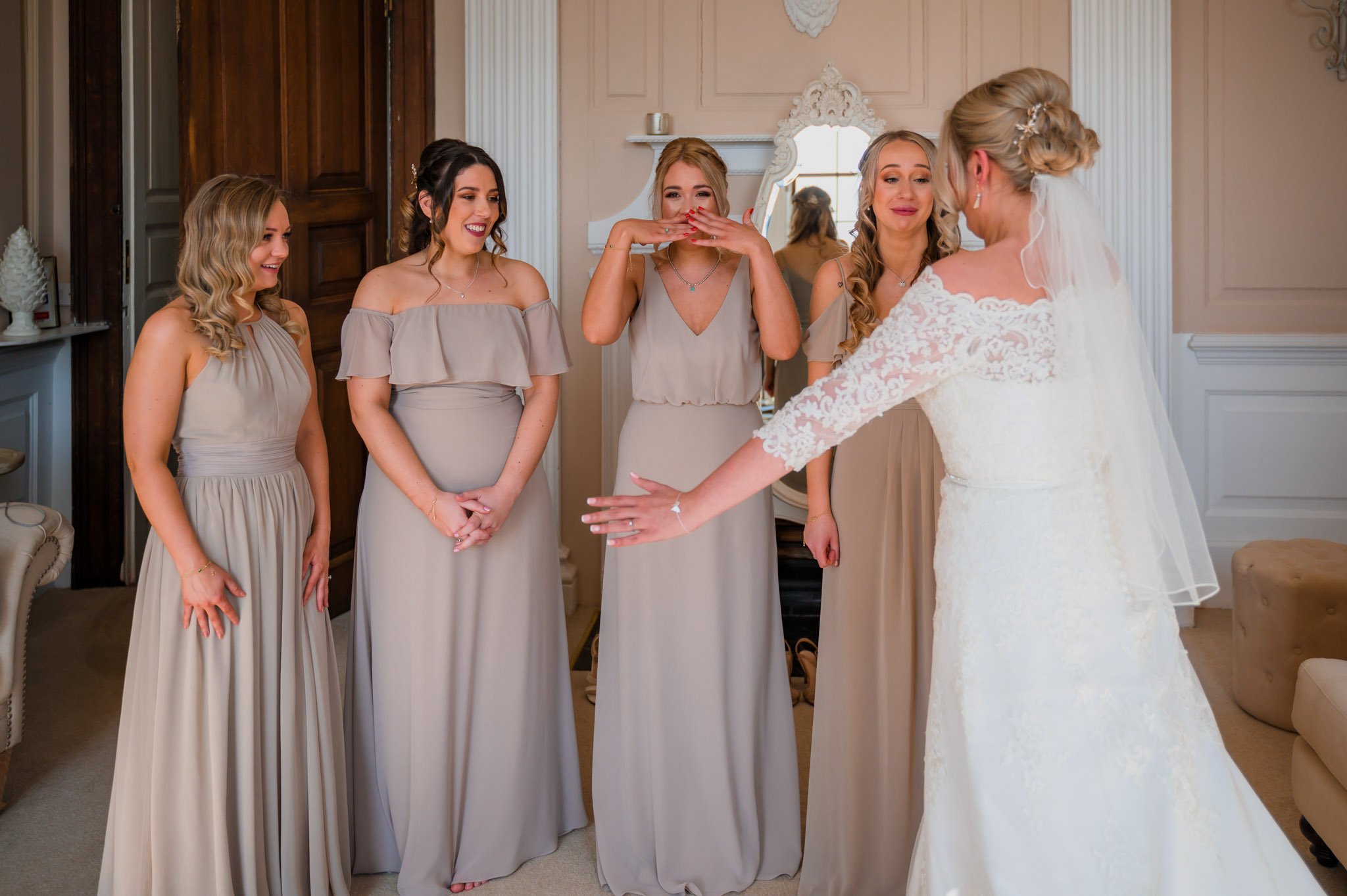 Bridesmaids get emotional at the first look