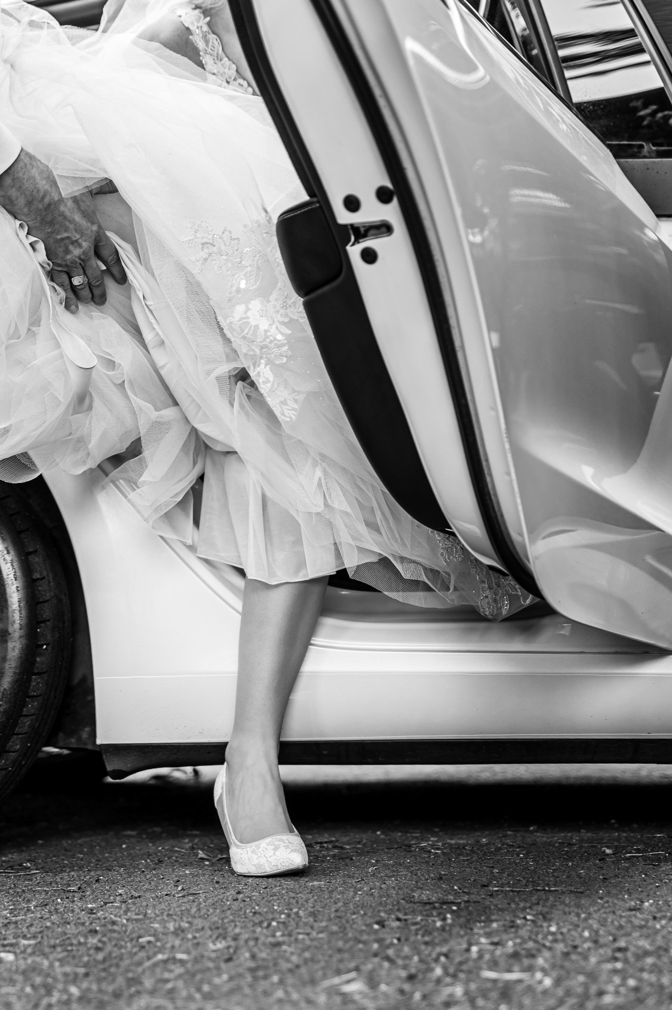 Bride stepping out of the car