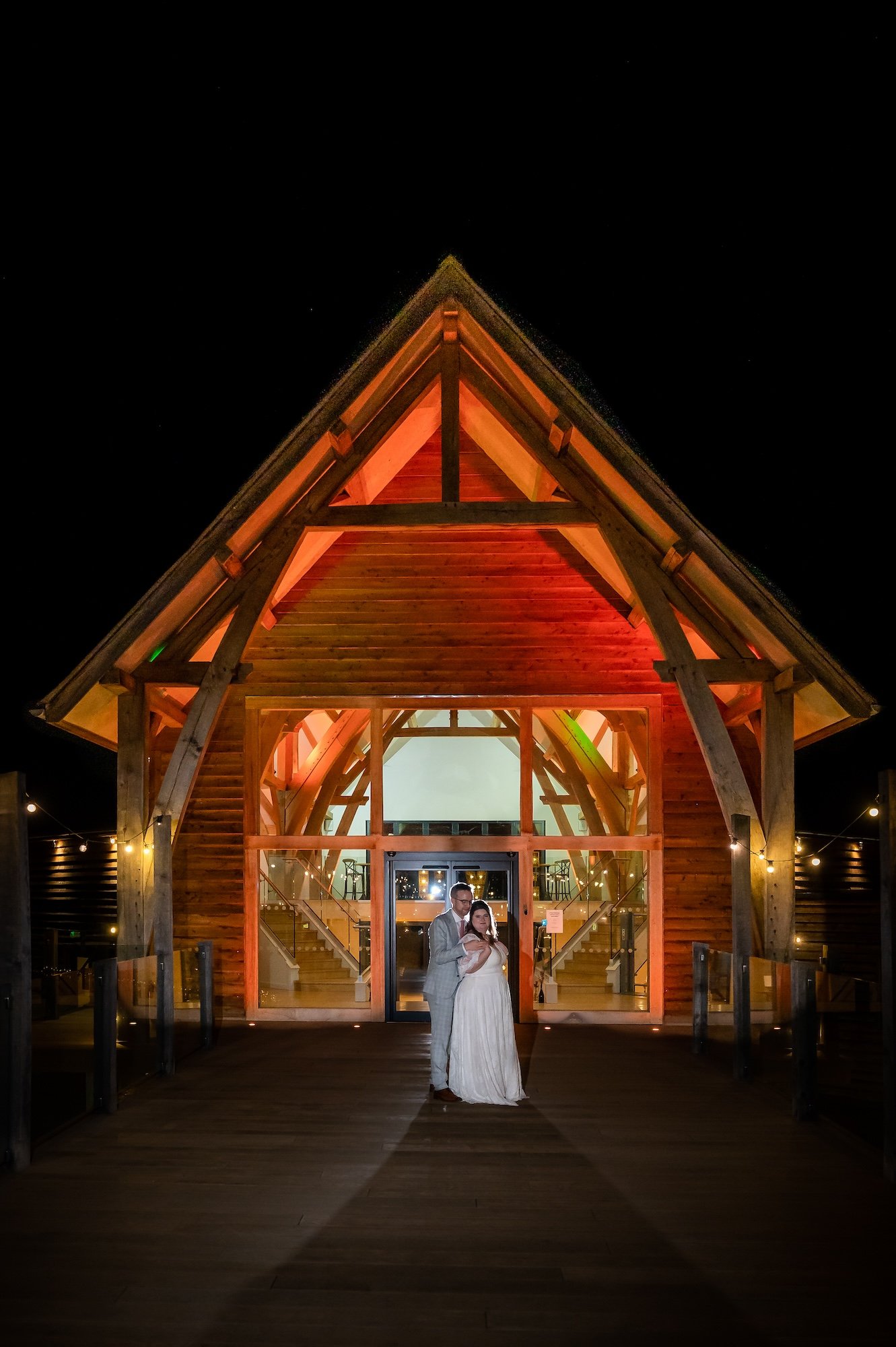 Alicia and Ray on the footbridge at night at The Mill Barns Wedding Venue