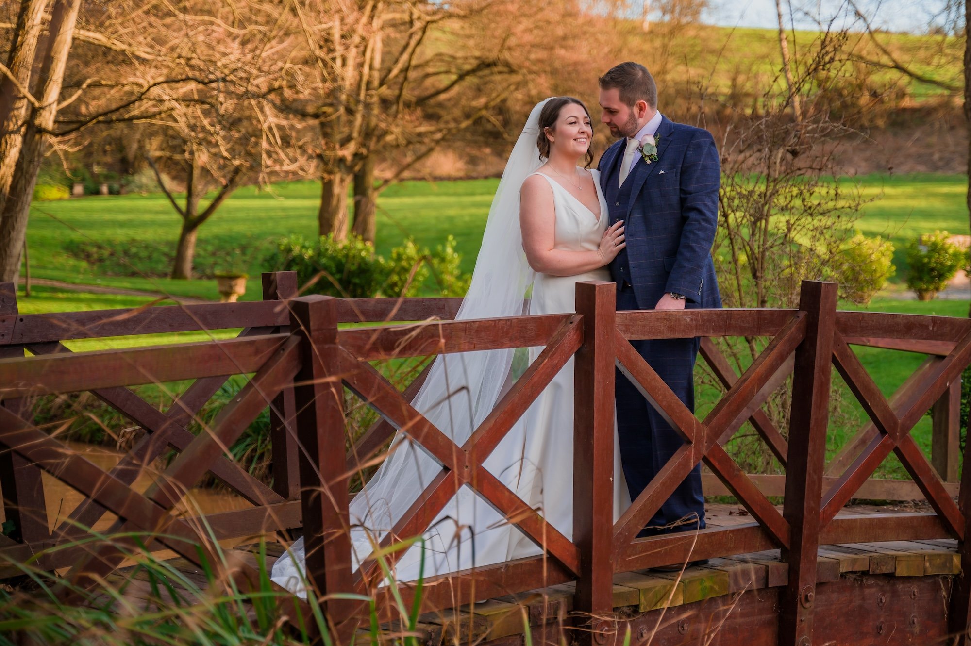 Couple on the bridge at The Mill Barns Wedding Venue