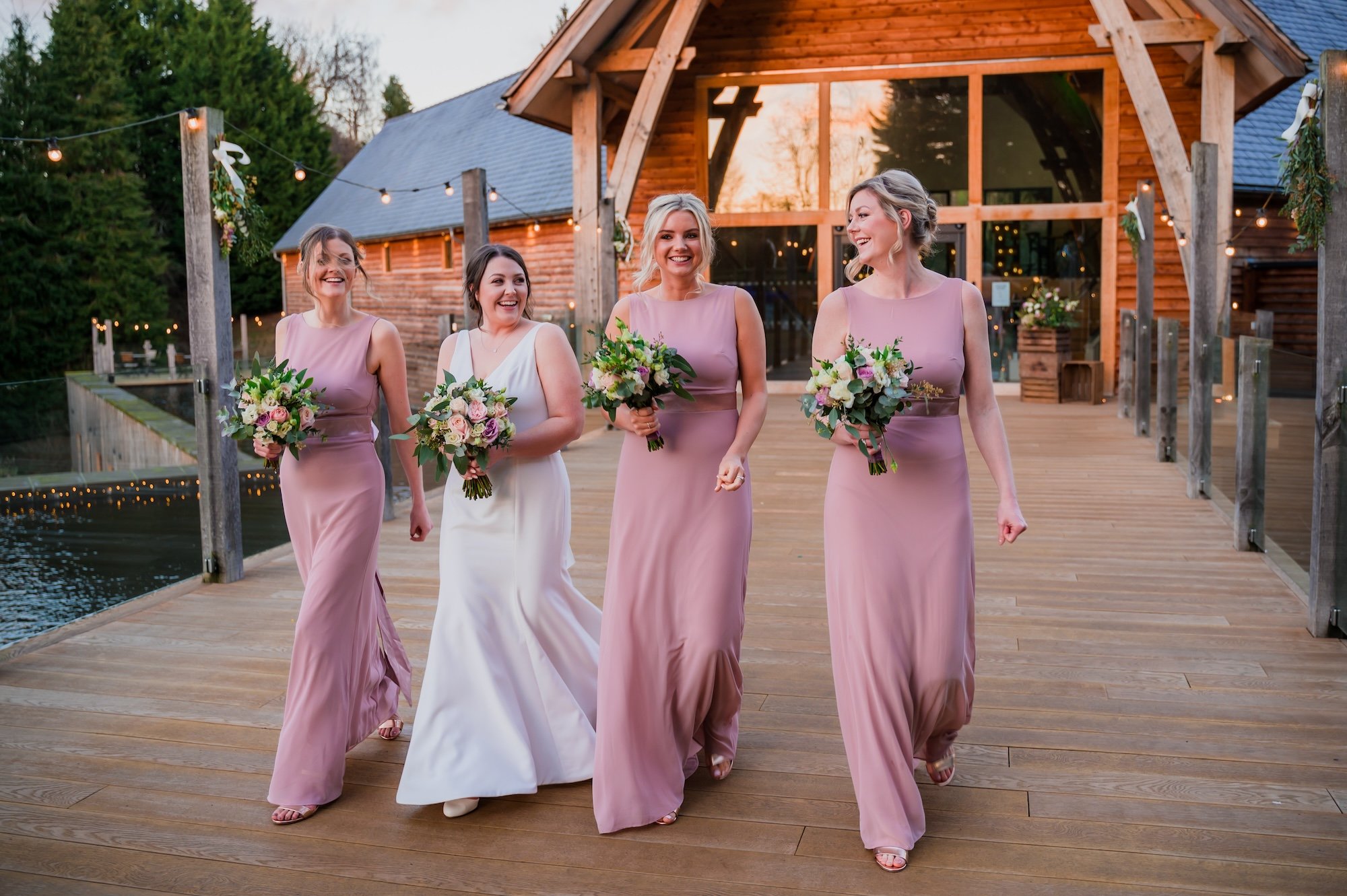 Bride tribe on the footbridge at The Mill Barns Wedding Venue