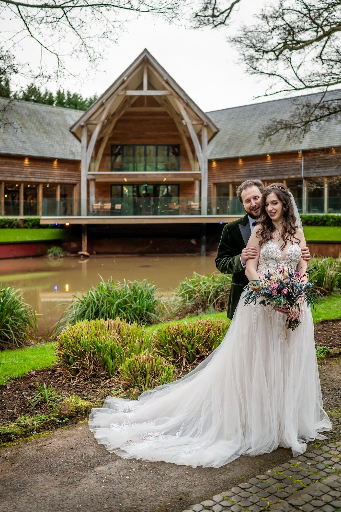 The Mill Barns Wedding Venue in the background for Jen and Tom