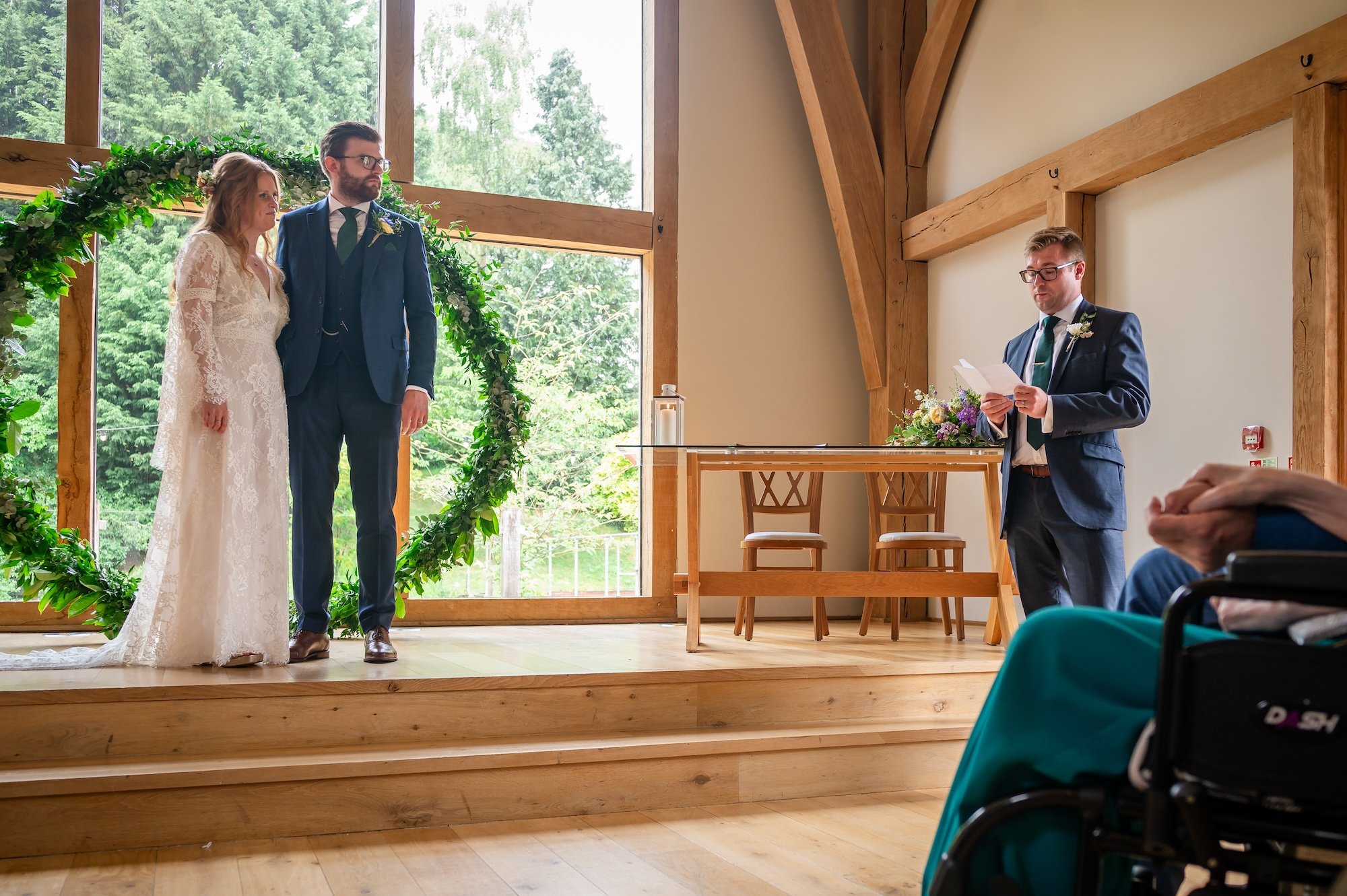 Guest gives a reading on the ceremony room at The Mill Barns Wedding Venue