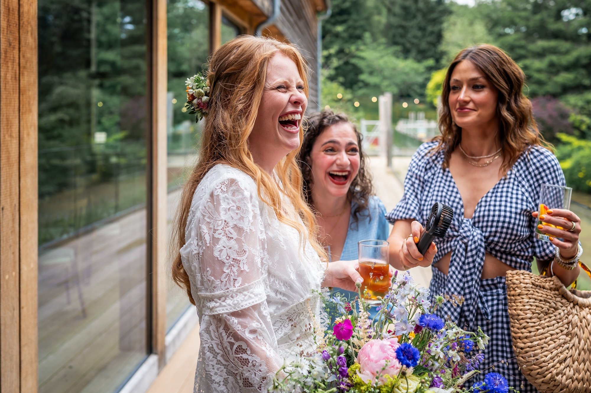 Rhian and guests laughing at The Mill Barns Wedding Venue