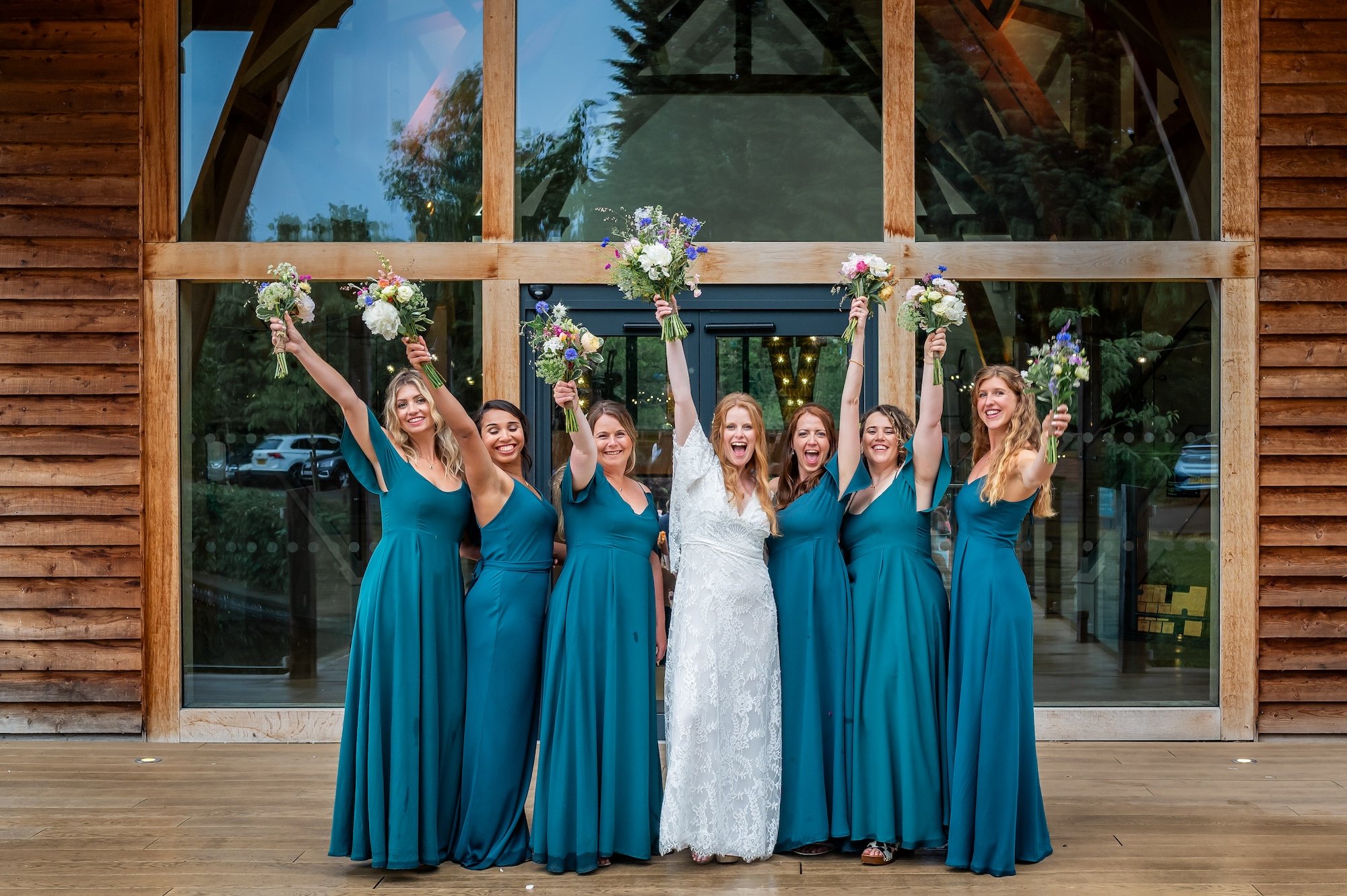Rhian and her bridesmaids on the footbridge at The Mill Barns Wedding Venue