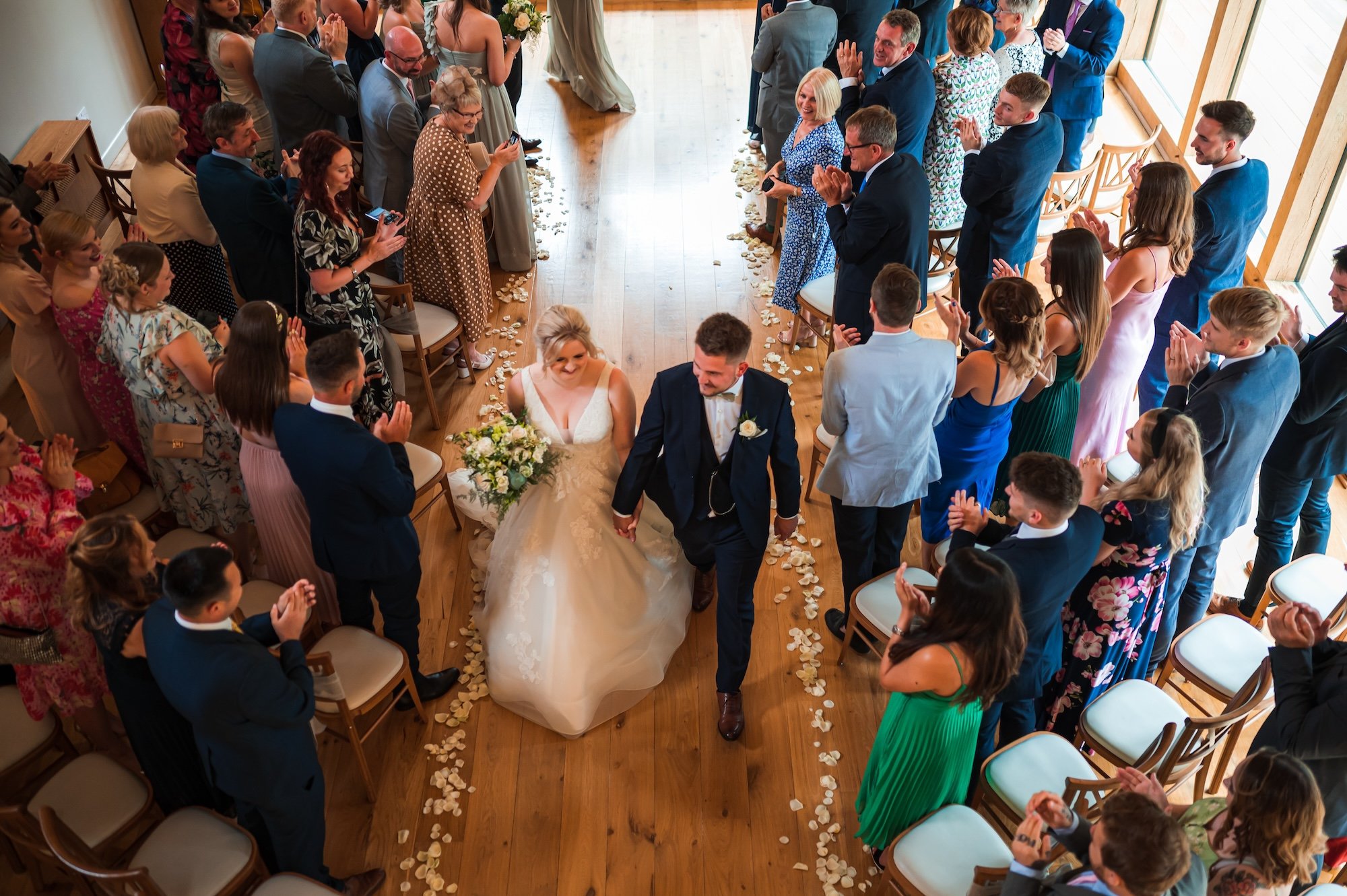 Sophie and Sam down the aisle from above at The Mill Barns Wedding Venue